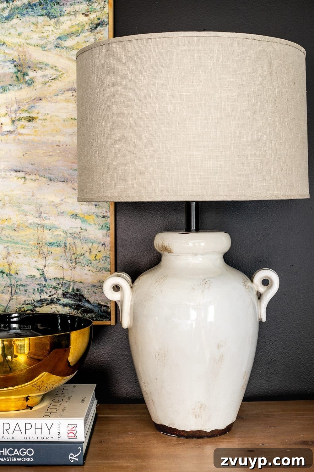 A Masterpiece in Mood: Our Modern Vintage Master Bedroom Unveiled 17 Master bedroom dresser featuring a stylish and affordable table lamp, adding a warm glow and a touch of luxury to the space.