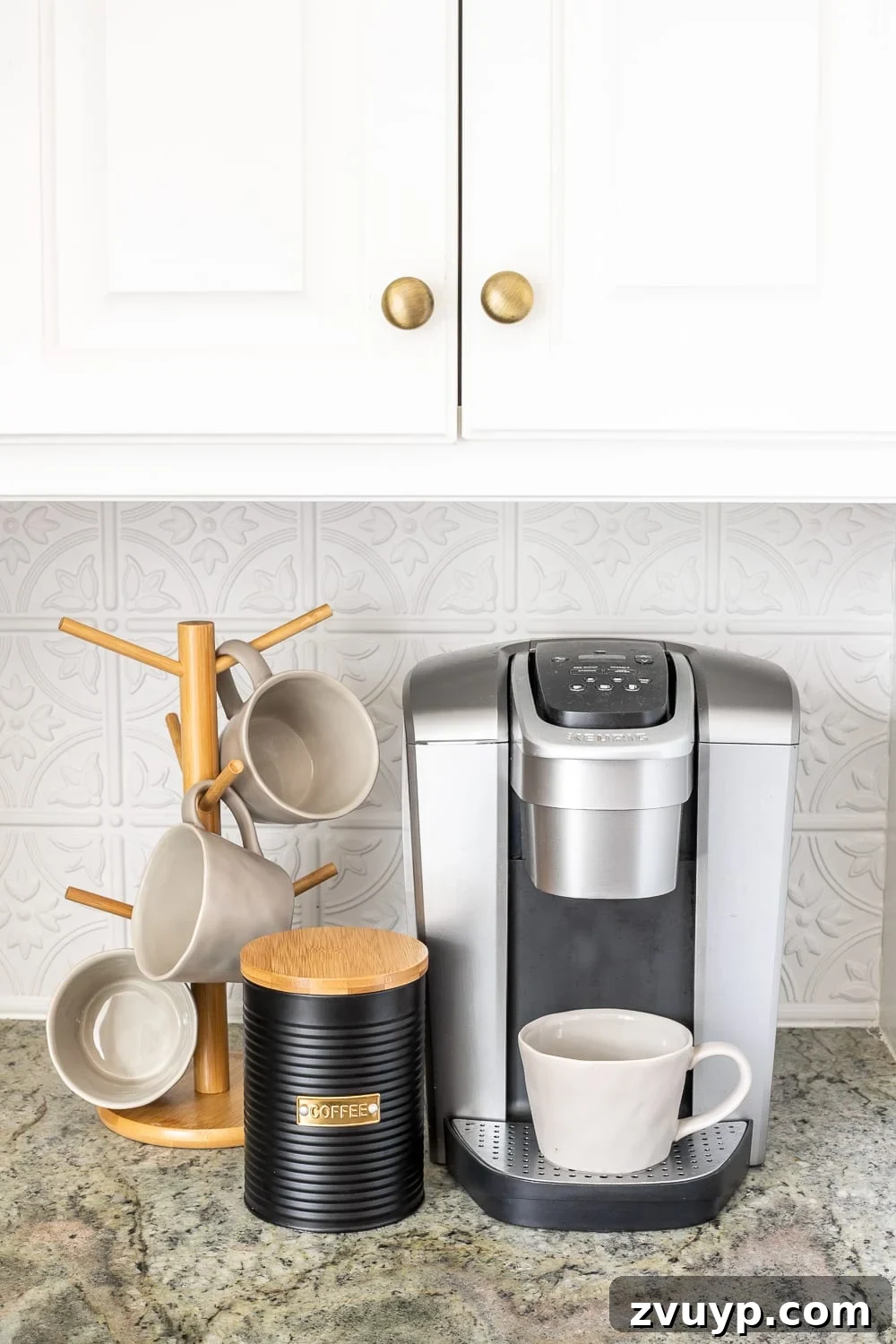 Stylish Kitchen Counters Made Simple 13 Organized coffee station on a kitchen countertop with mugs and coffee canister