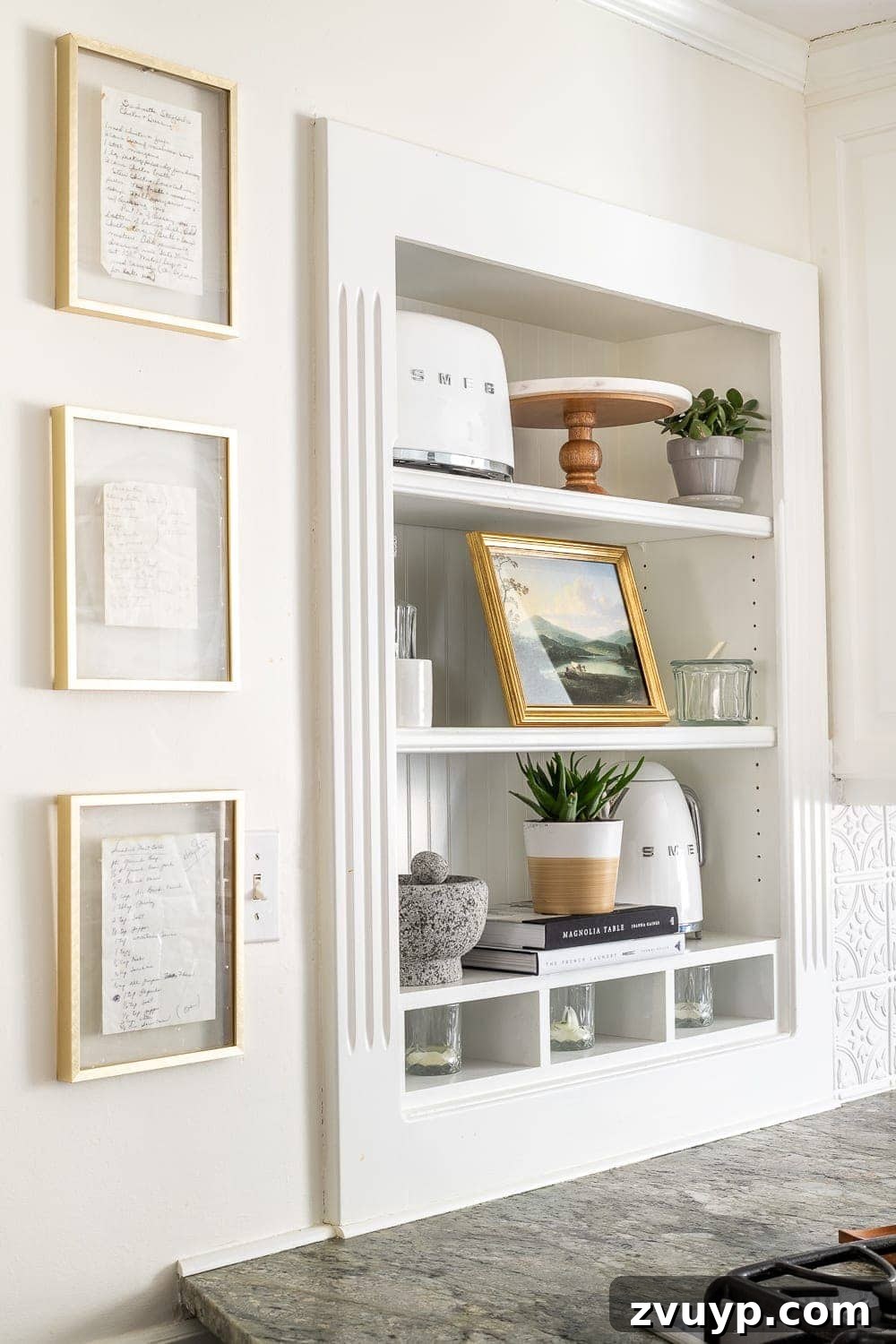 Simple Ways to Style Your Shelves 17 An overview of a meticulously styled kitchen, emphasizing the elegant and balanced shelf decor.