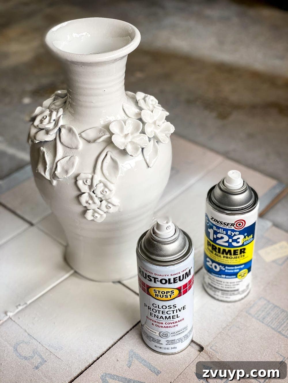 From Knock-Off to Showpiece: Ceramic Bloom Vase Transformation 3 Applying primer to ceramic vase, a crucial first step for paint adhesion and a smooth finish.
