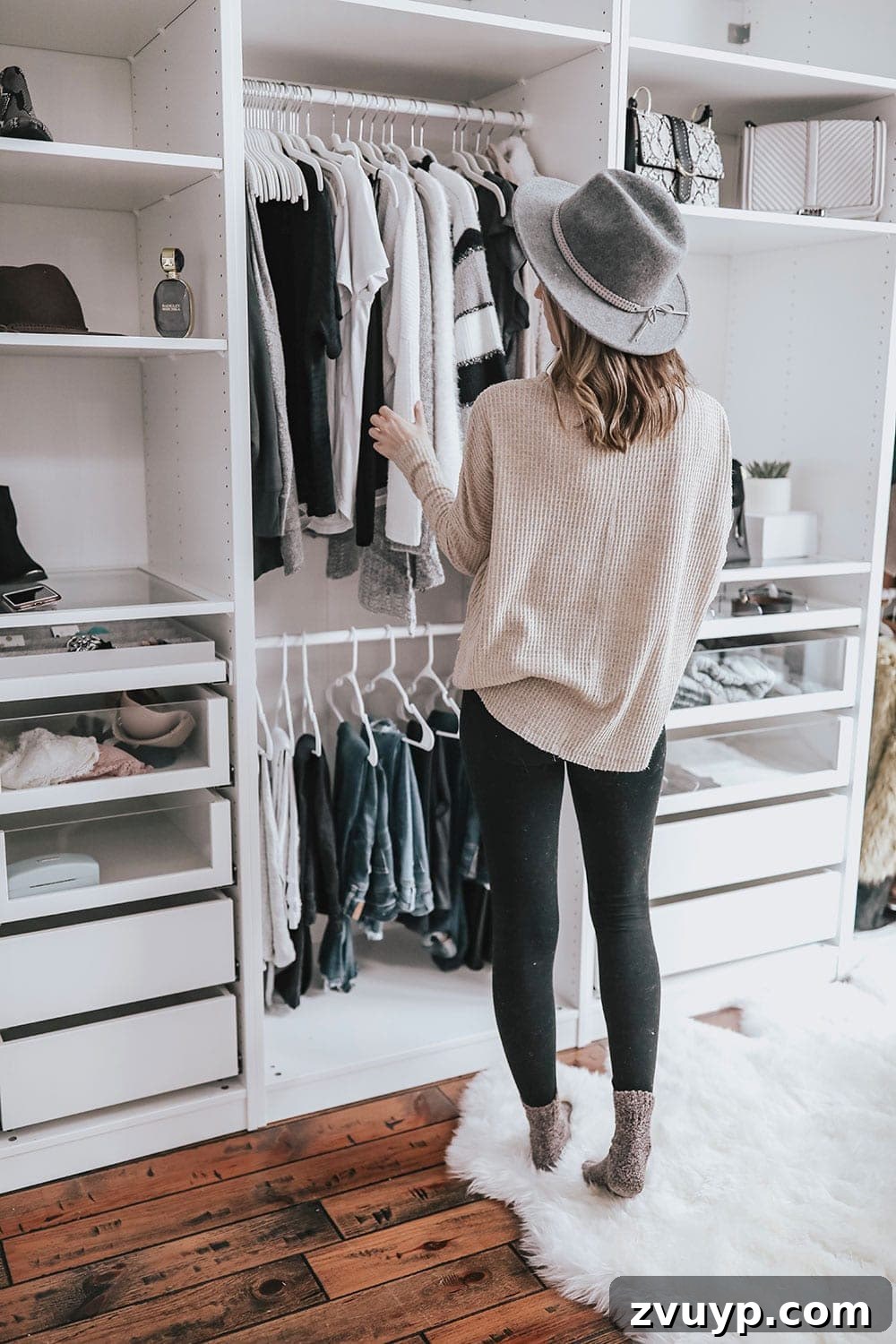 Smart DIY Upgrades for Your IKEA Pax Wardrobe 11 A minimalist closet design featuring sleek, built-in wardrobes, showcasing a clean and uncluttered approach to clothing storage.