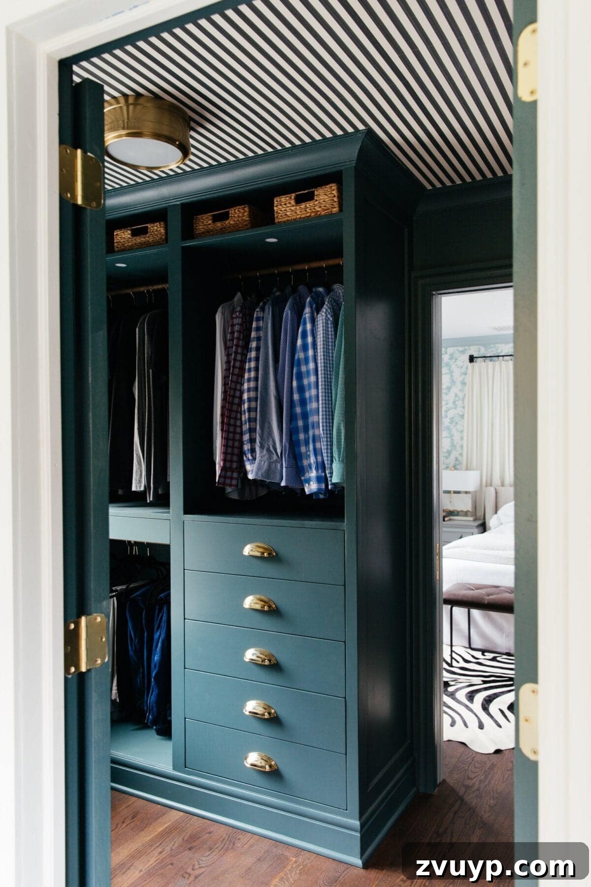 Smart DIY Upgrades for Your IKEA Pax Wardrobe 13 A striking blue-green IKEA PAX closet complemented by a dynamic striped ceiling, adding bold color and pattern to the space.