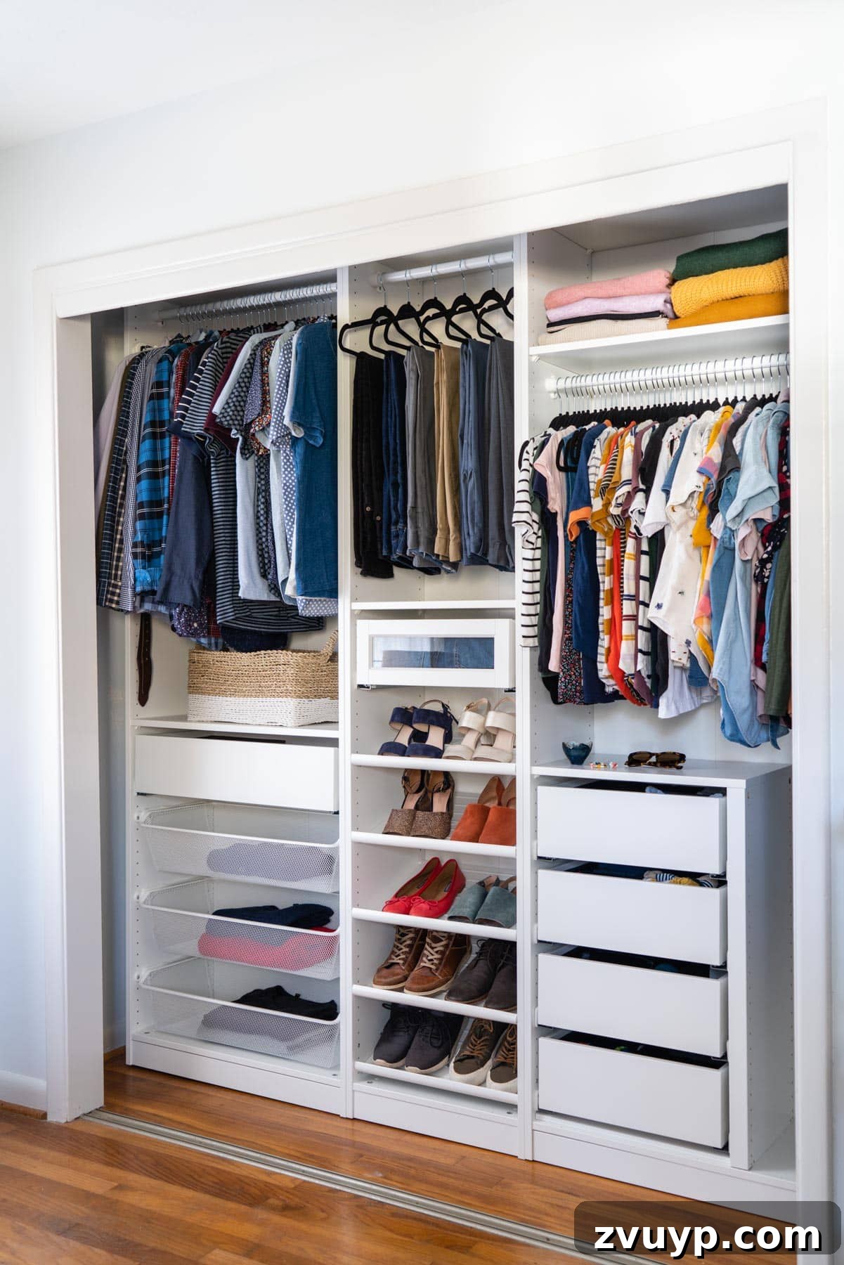 Smart DIY Upgrades for Your IKEA Pax Wardrobe 24 A reach-in closet with its doors removed, showcasing an open and highly accessible clothing storage solution.