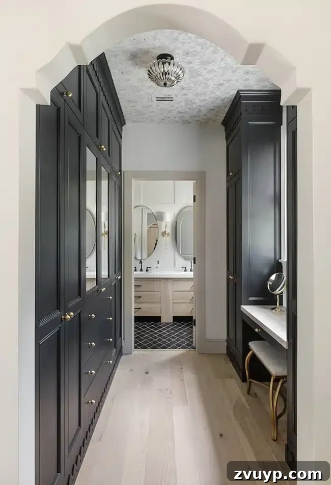 Smart DIY Upgrades for Your IKEA Pax Wardrobe 32 Black IKEA PAX wardrobes with doors and a vanity in a primary en suite, enhanced by detailed trim for a custom look.
