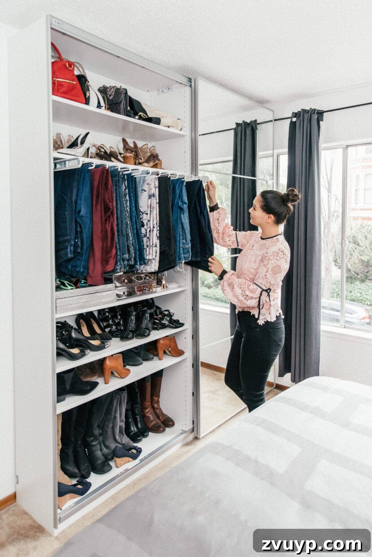 Smart DIY Upgrades for Your IKEA Pax Wardrobe 9 A closet equipped with a convenient pull-out pants bar and integrated shoe storage, optimizing space and accessibility.