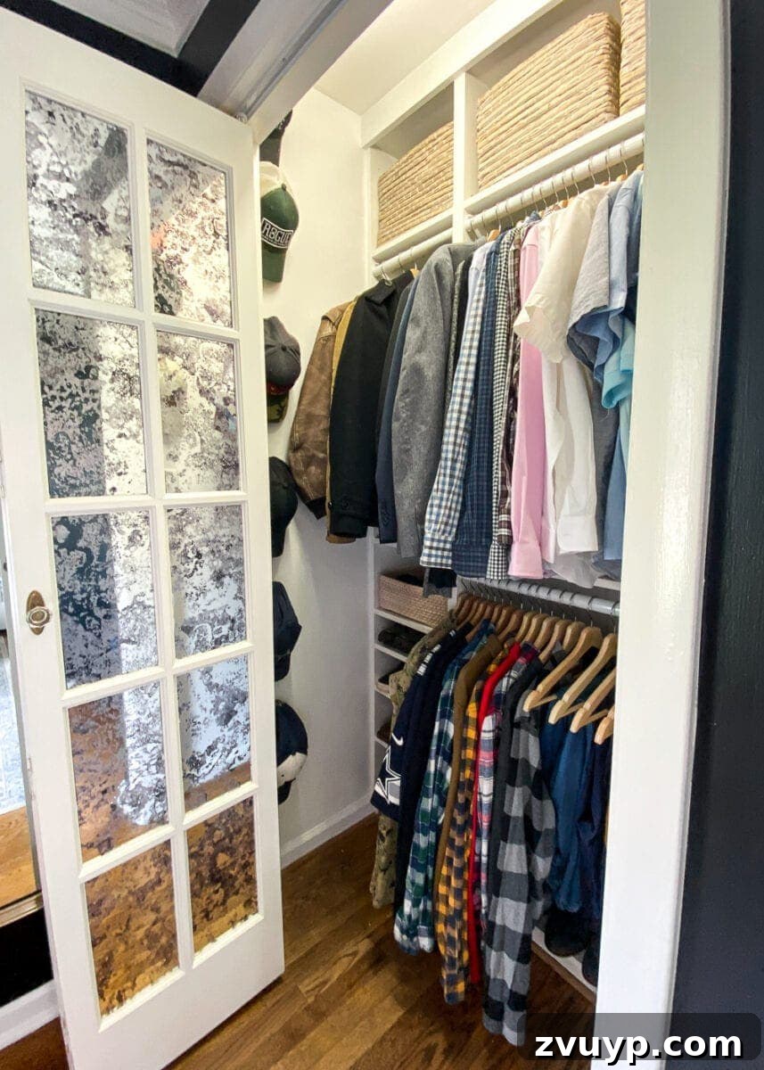 Your Definitive Guide to a Decluttered Wardrobe 3 Neatly organized men's closet with hung shirts, pants, and accessories.