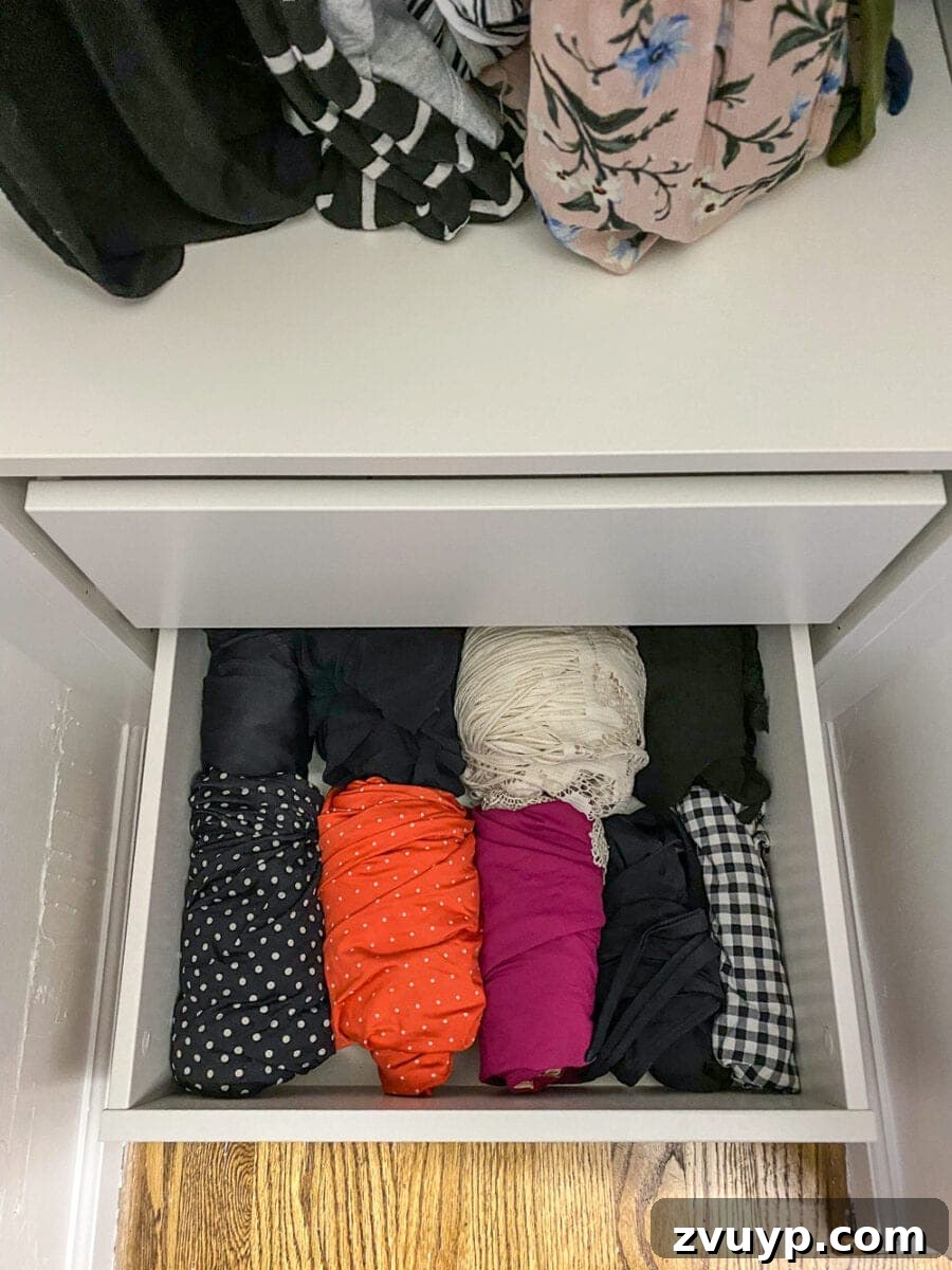 Small Master, Smart Storage: Our IKEA Closet Reveal 14 Lauren's closet featuring specialized Pax drawers for swimwear and shapewear, neatly concealed.