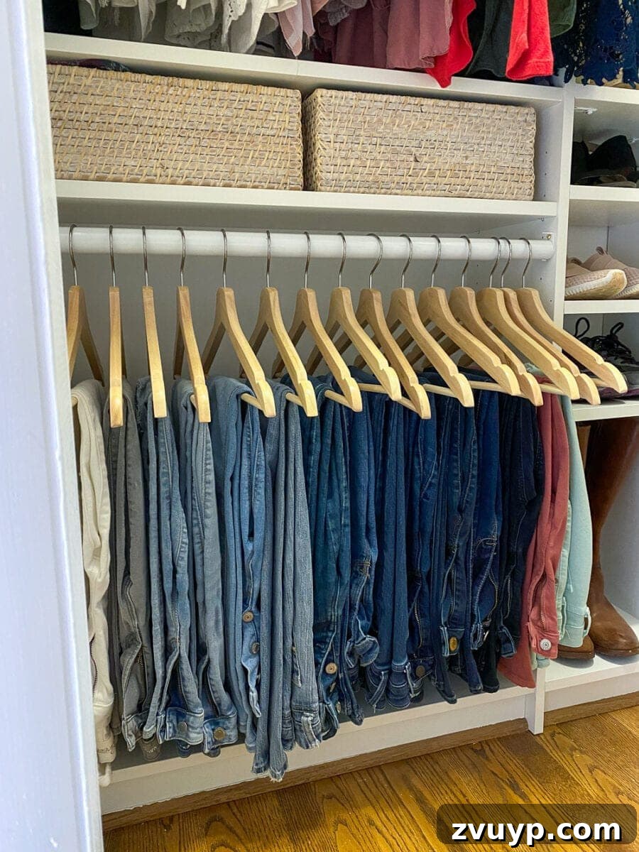 Small Master, Smart Storage: Our IKEA Closet Reveal 16 Lauren's expertly organized clothing rack, showing garments sorted by category and color for easy outfit selection.