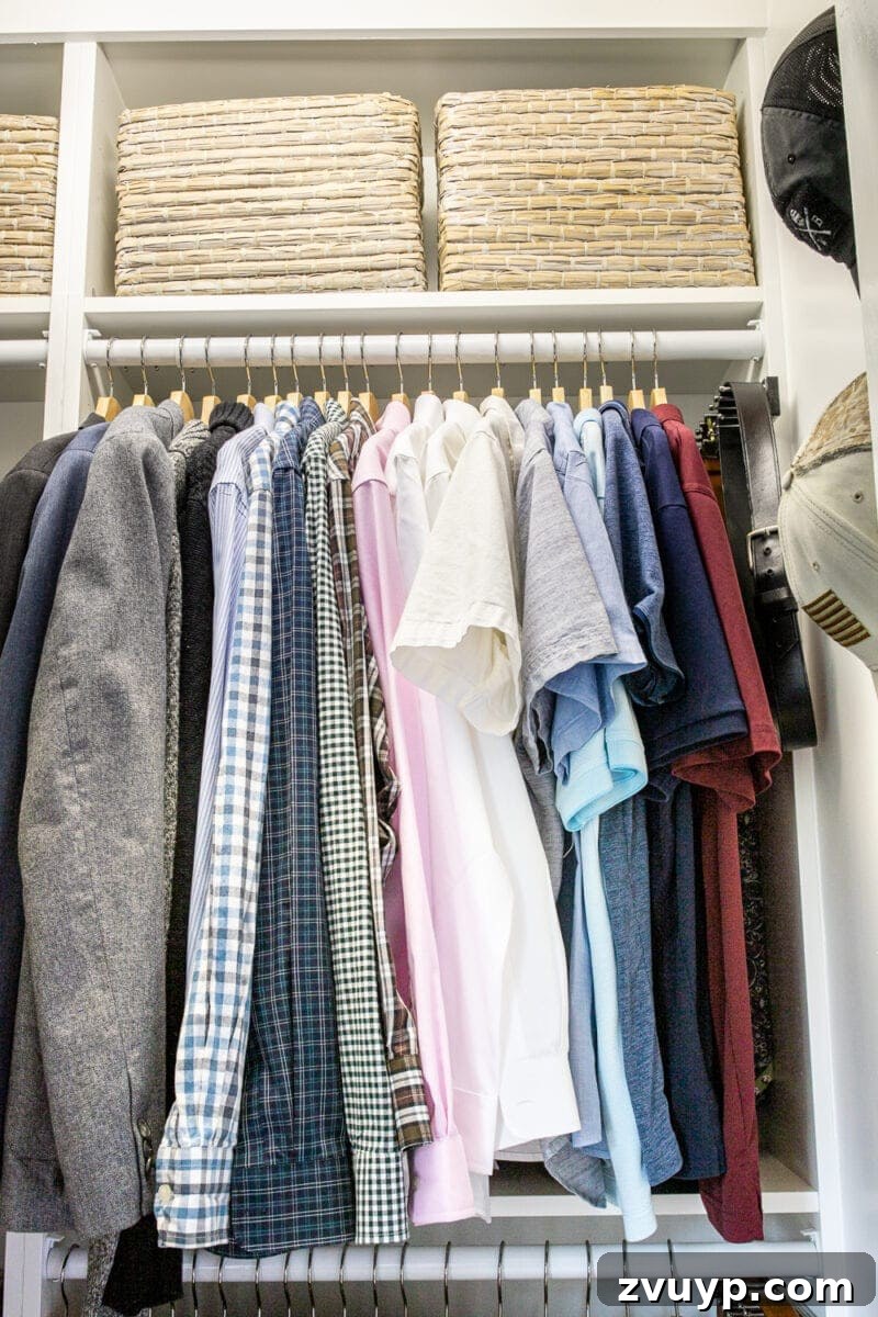 Small Master, Smart Storage: Our IKEA Closet Reveal 7 Detail shot of Robert's organized closet, showing the use of baskets for smaller items and a custom shoe shelf.