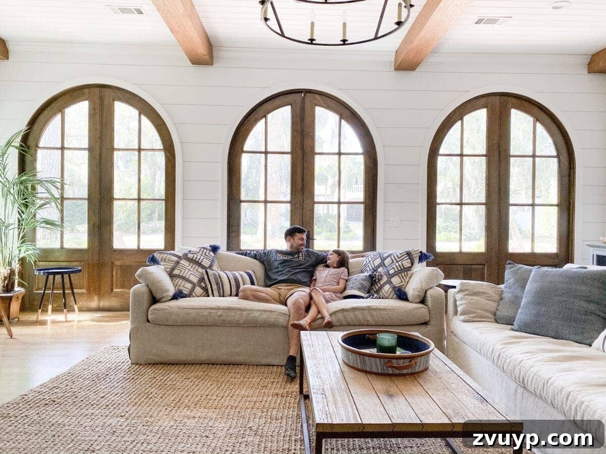 Sea Island Coastal Home Showcase 4 Chic and airy living room of a Sea Island coastal house, featuring abundant natural light and elegant decor