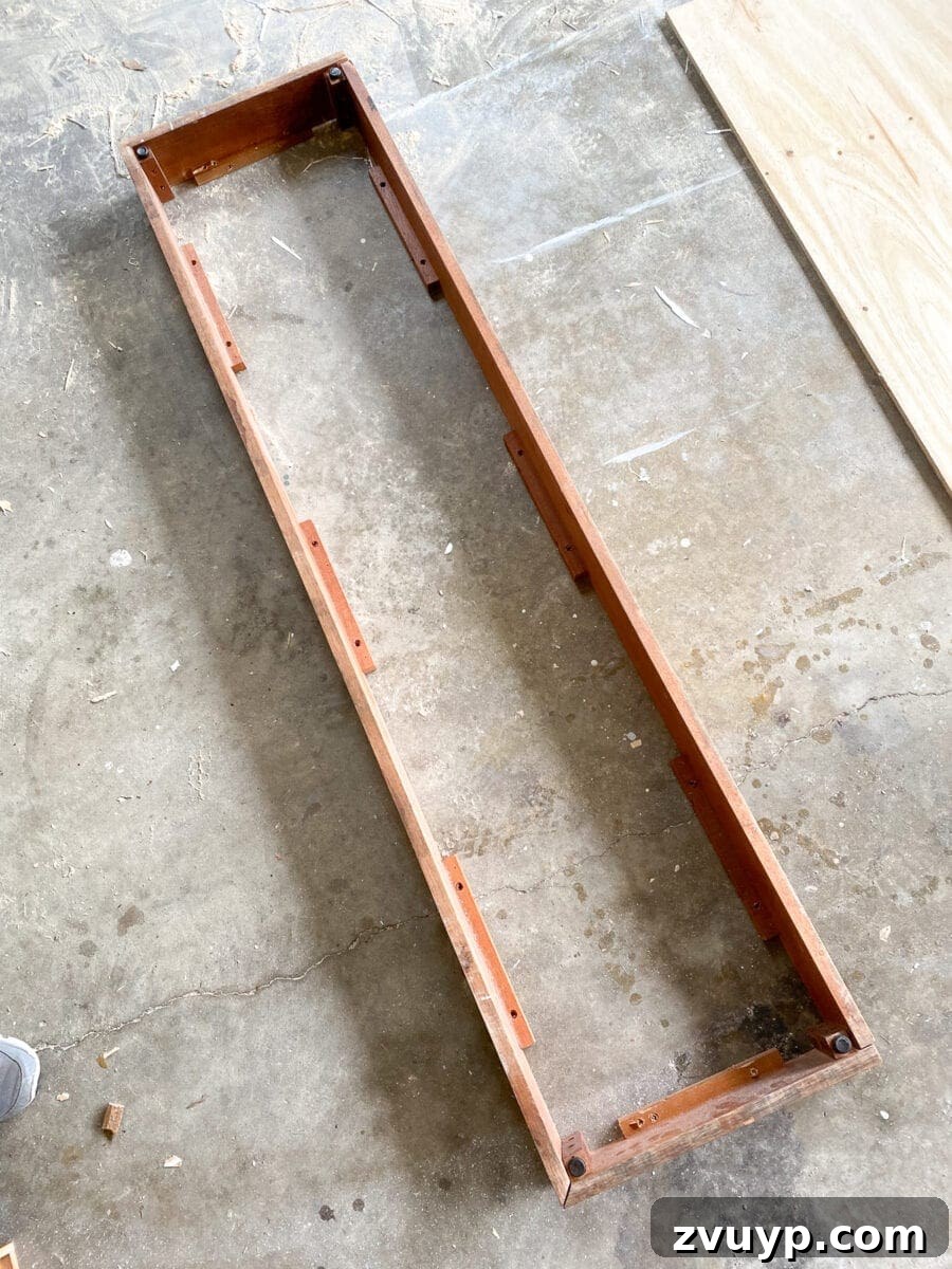 Craft a Vertical Garden from Reclaimed Wood 2 Stylish DIY vertical wall planter made from reclaimed wood, showcasing a variety of vibrant succulents for a fresh spring or summer garden project.