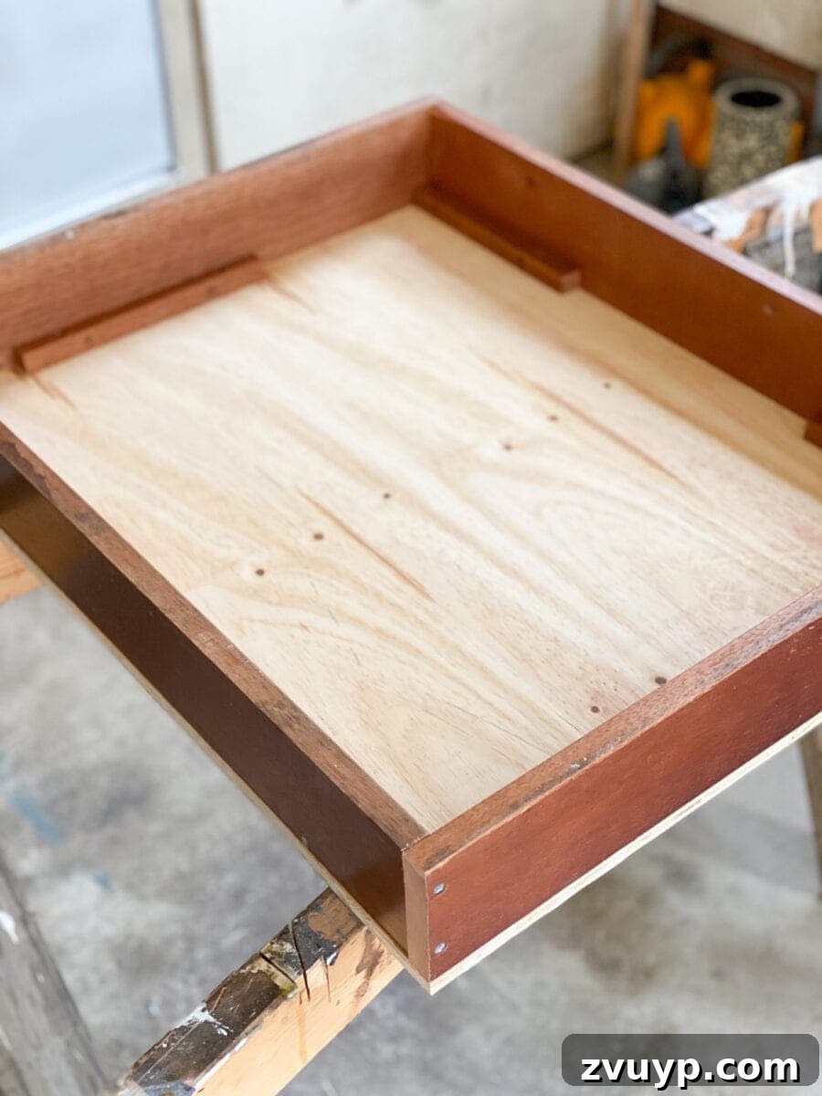 Craft a Vertical Garden from Reclaimed Wood 11 Final view of the plywood back securely attached to the wooden frame, forming the basic structure of the vertical planter.