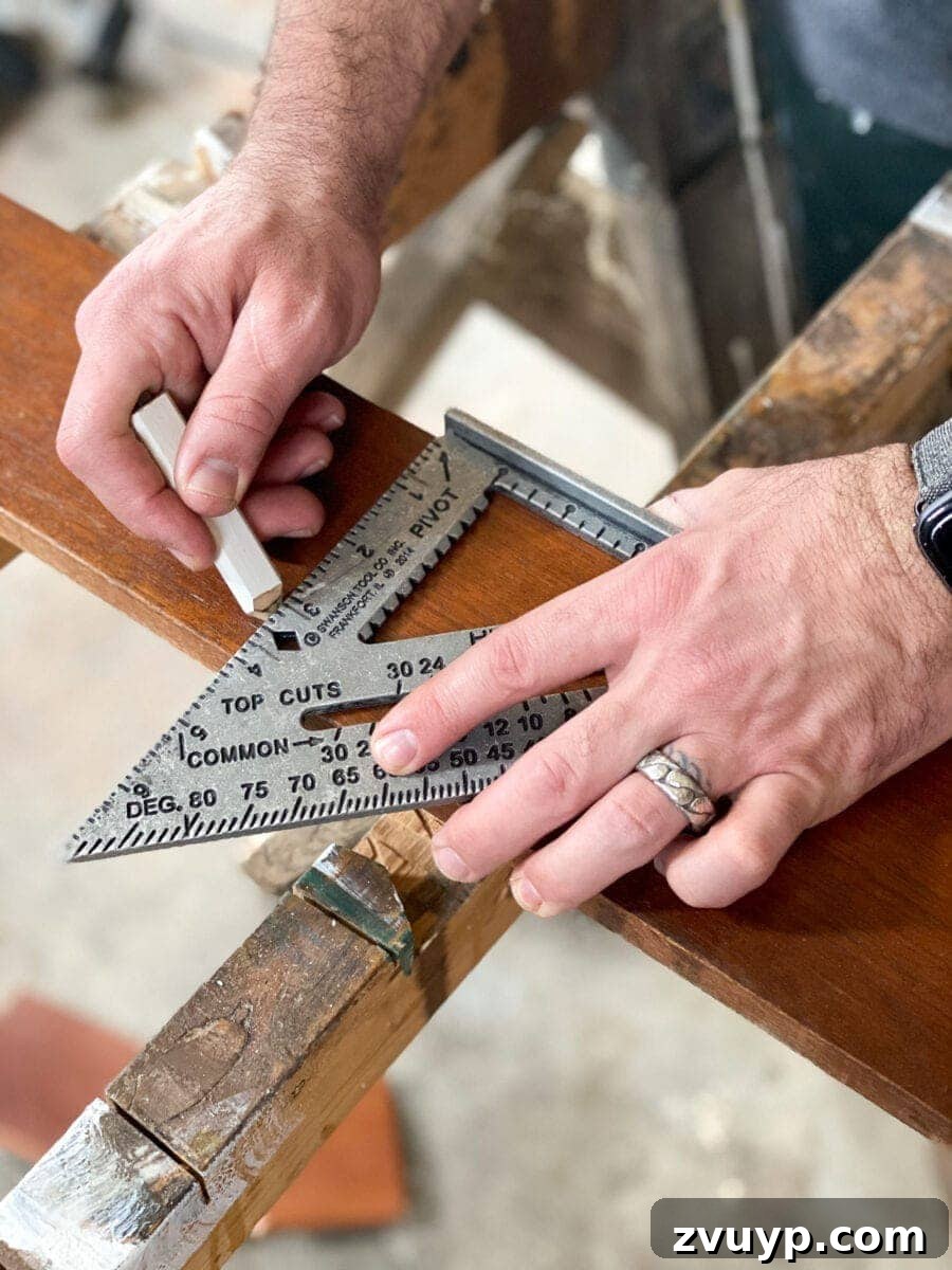 Craft a Vertical Garden from Reclaimed Wood 5 Measuring and marking scrap wood planks for a DIY vertical wall planter project, ensuring precise cuts for the frame.