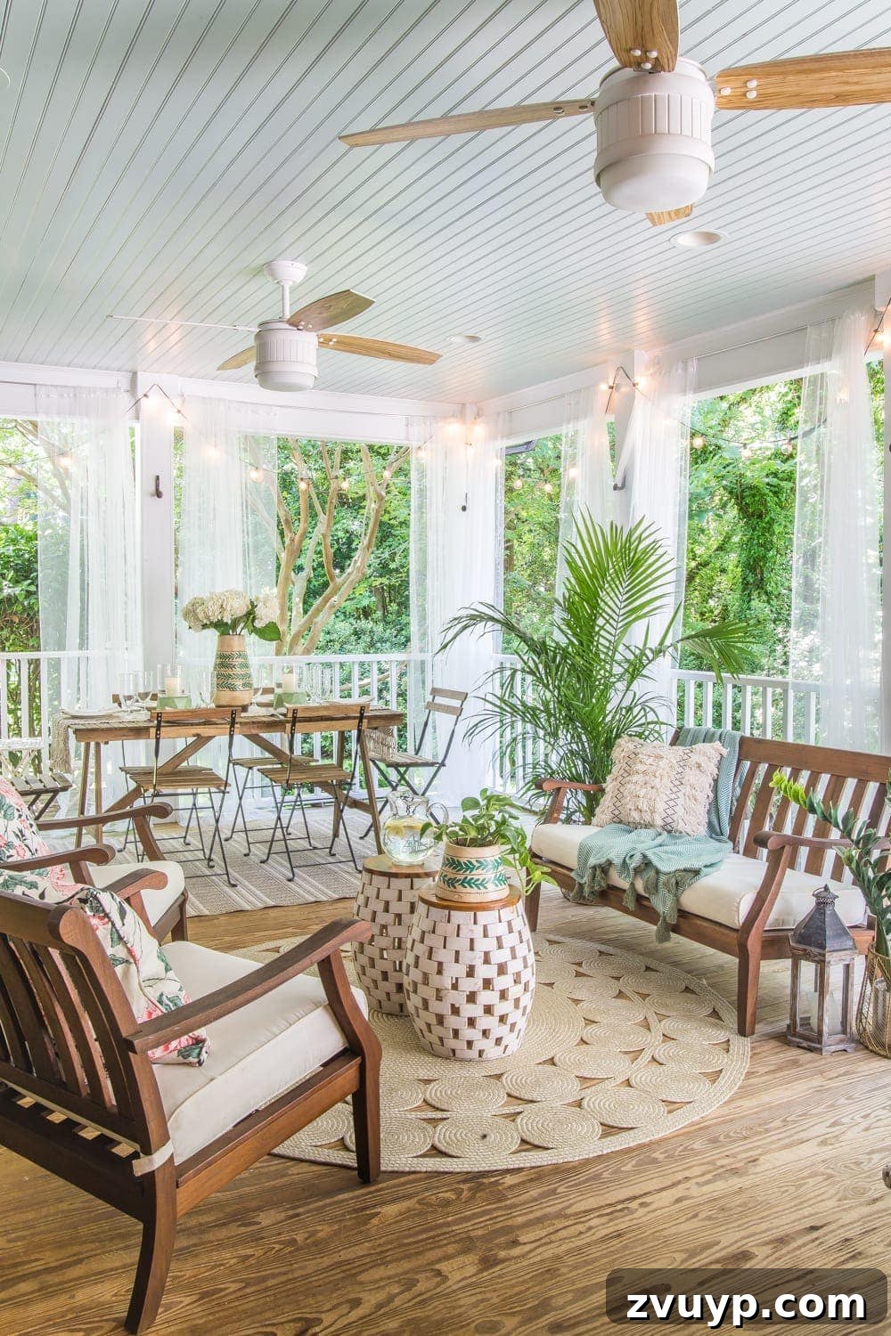 After photo of the inviting back porch with blue ceiling and comfortable outdoor furniture