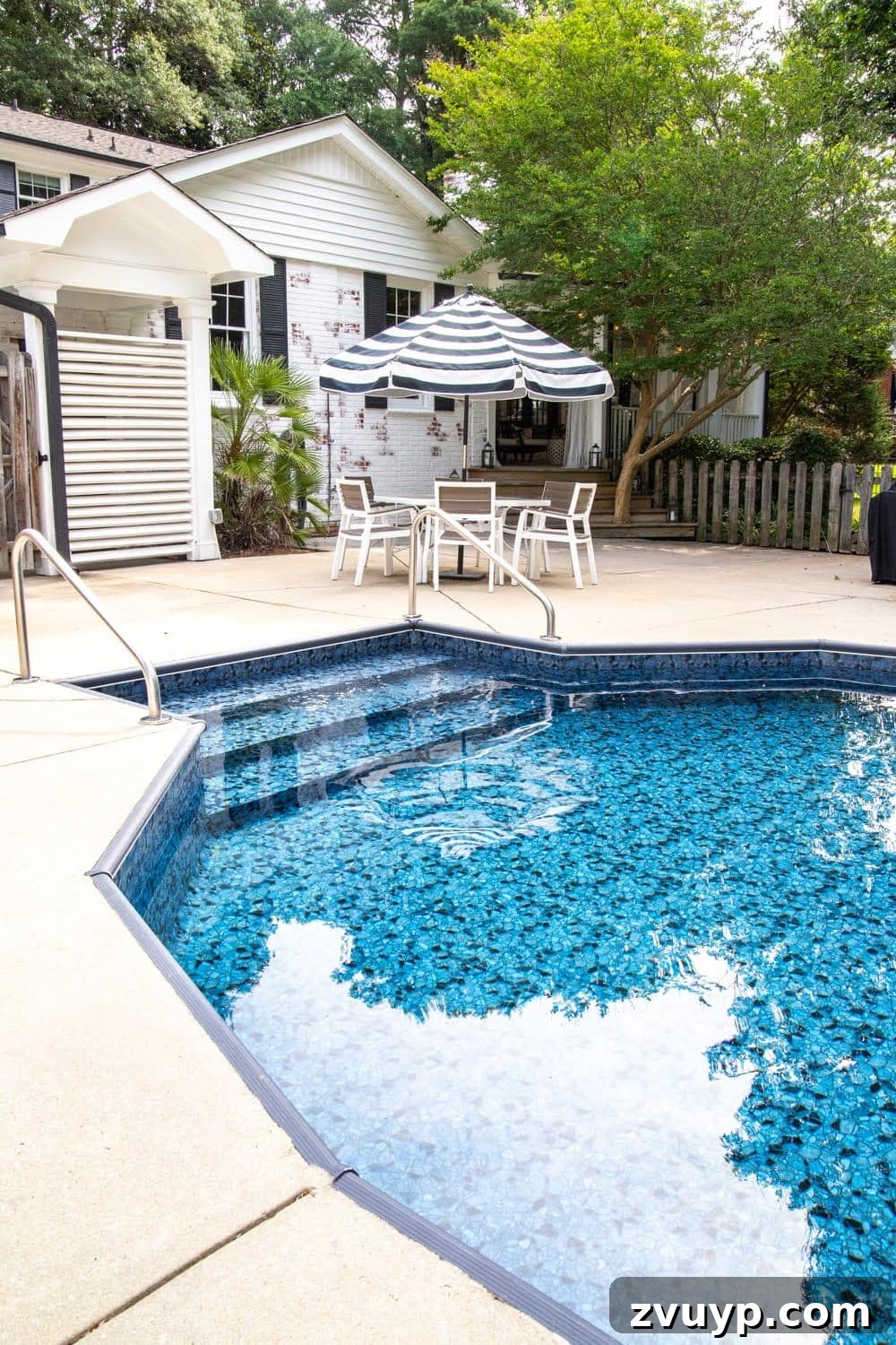 After photo of the renovated swimming pool area with new liner and outdoor seating