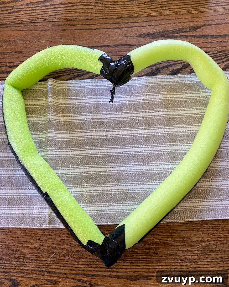 Transforming a Pool Noodle into a Unique Wreath 6 Securing pool noodle with duct tape
