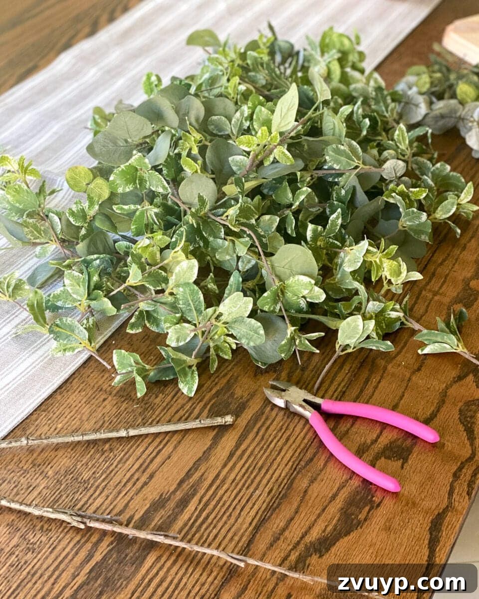 Transforming a Pool Noodle into a Unique Wreath 9 Snipping artificial greenery stems with wire cutters