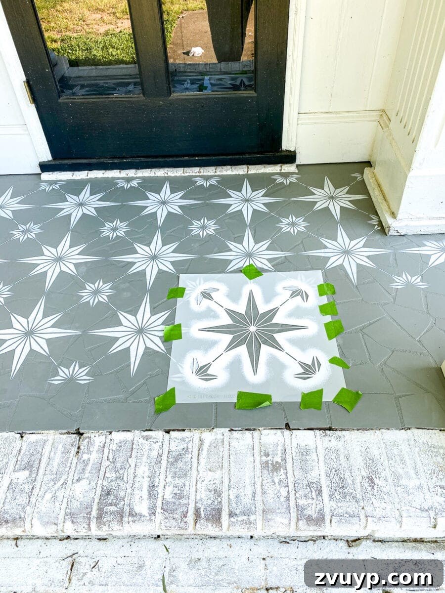 Patterned Porch Floor Revival 9 Applying paint to the stencil on the porch floor, showing attention to detail