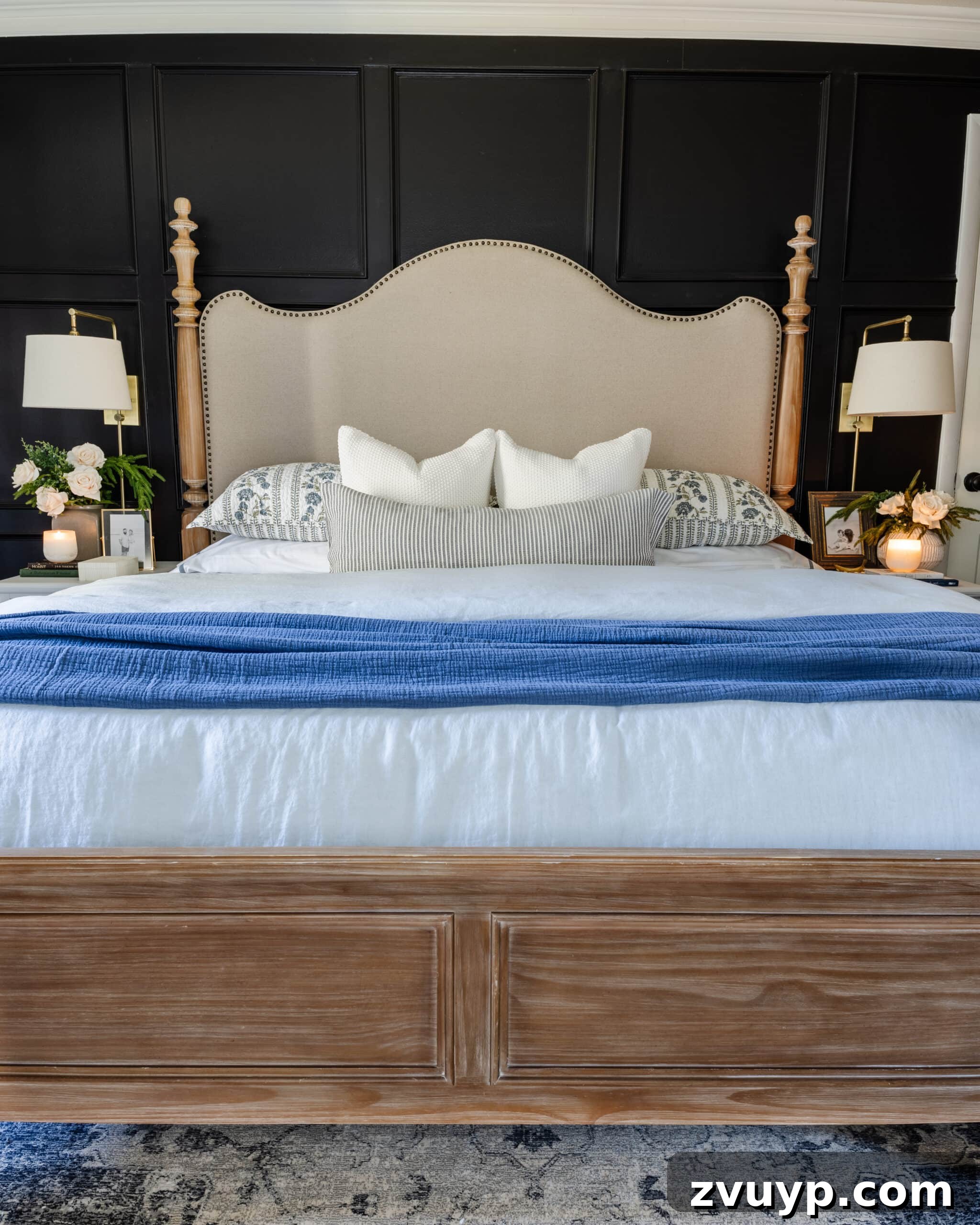 Expert Interior Paint Color Selection for Your Home 9 Black bedroom painted KILZ Rebel with upholstered wood poster bed and blue bedding