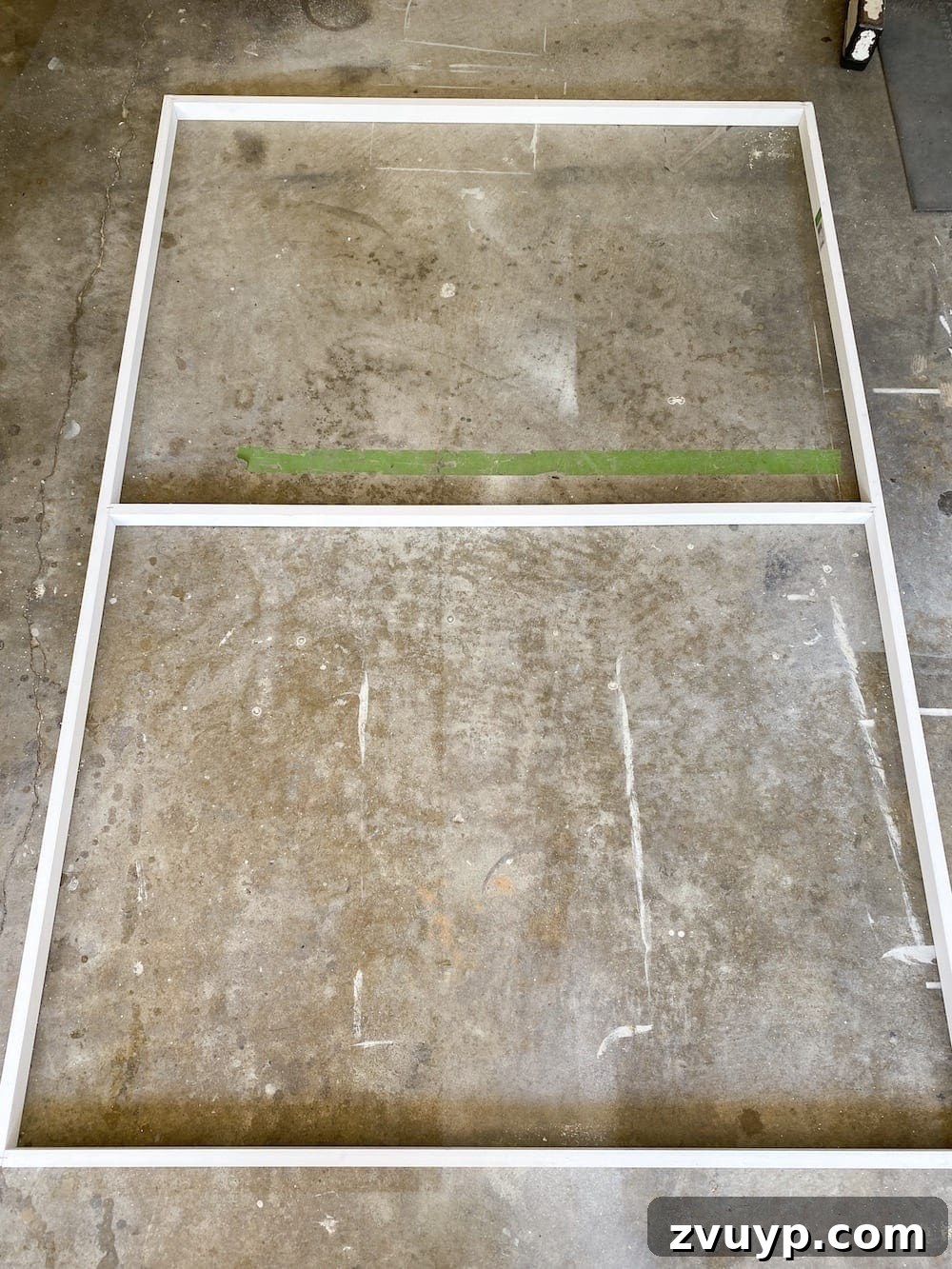 Transform a Shower Curtain into Statement Wall Art 5 1x2 wooden boards being cut to size for the internal frame of the DIY large wall art.
