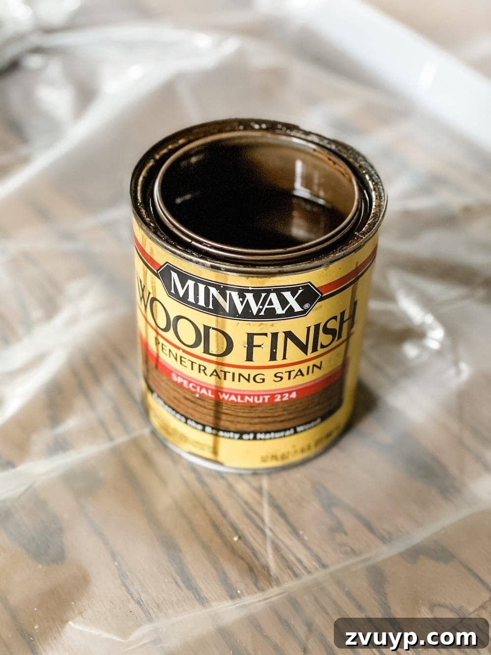 DIY Furniture Evolution: From Raw Wood to Custom Workspaces 3 Can of Minwax Special Walnut wood stain, a popular choice for custom furniture projects, highlighting the brand and color.