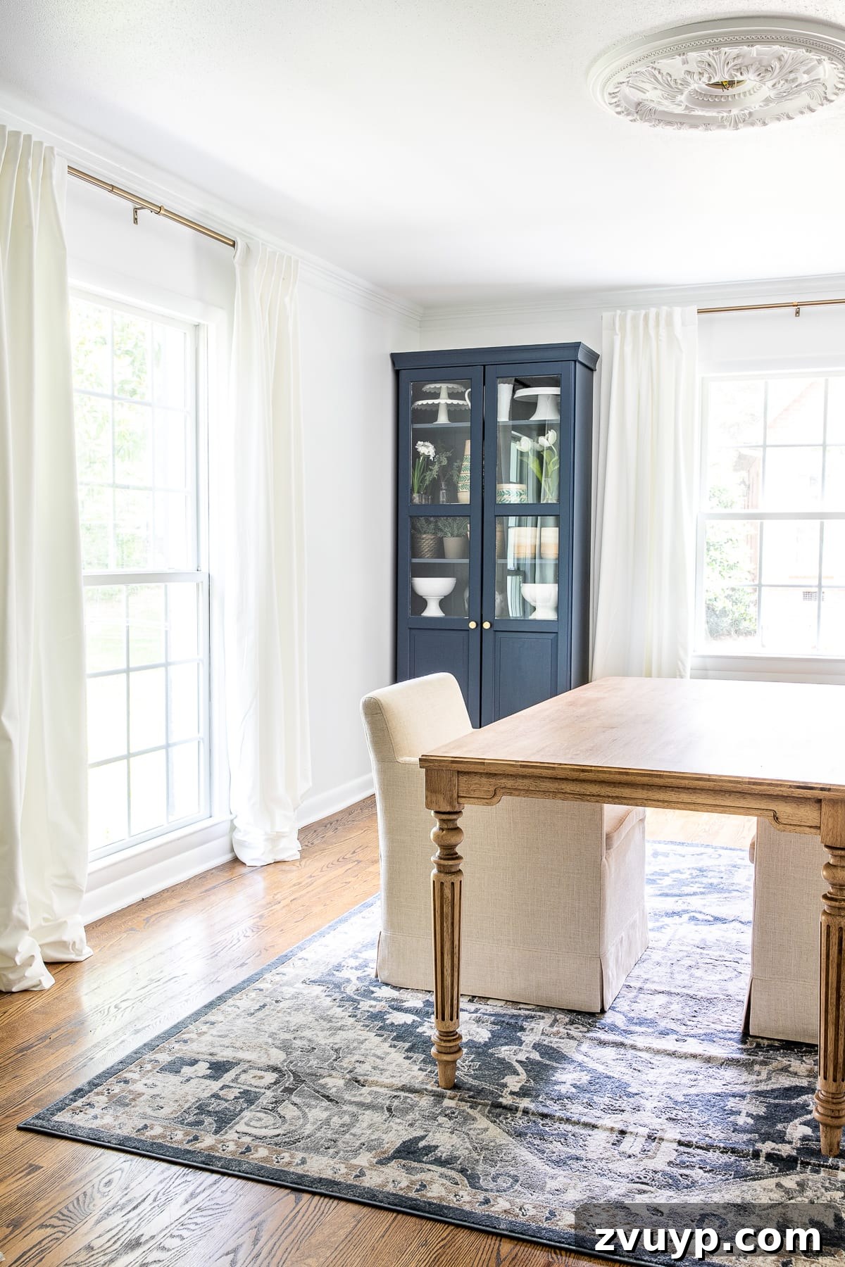 DIY Furniture Evolution: From Raw Wood to Custom Workspaces 7 A stylish and organized home office desk with a custom stained wood surface, showcasing decorative elements and office supplies, with a rolling armchair and rug visible.