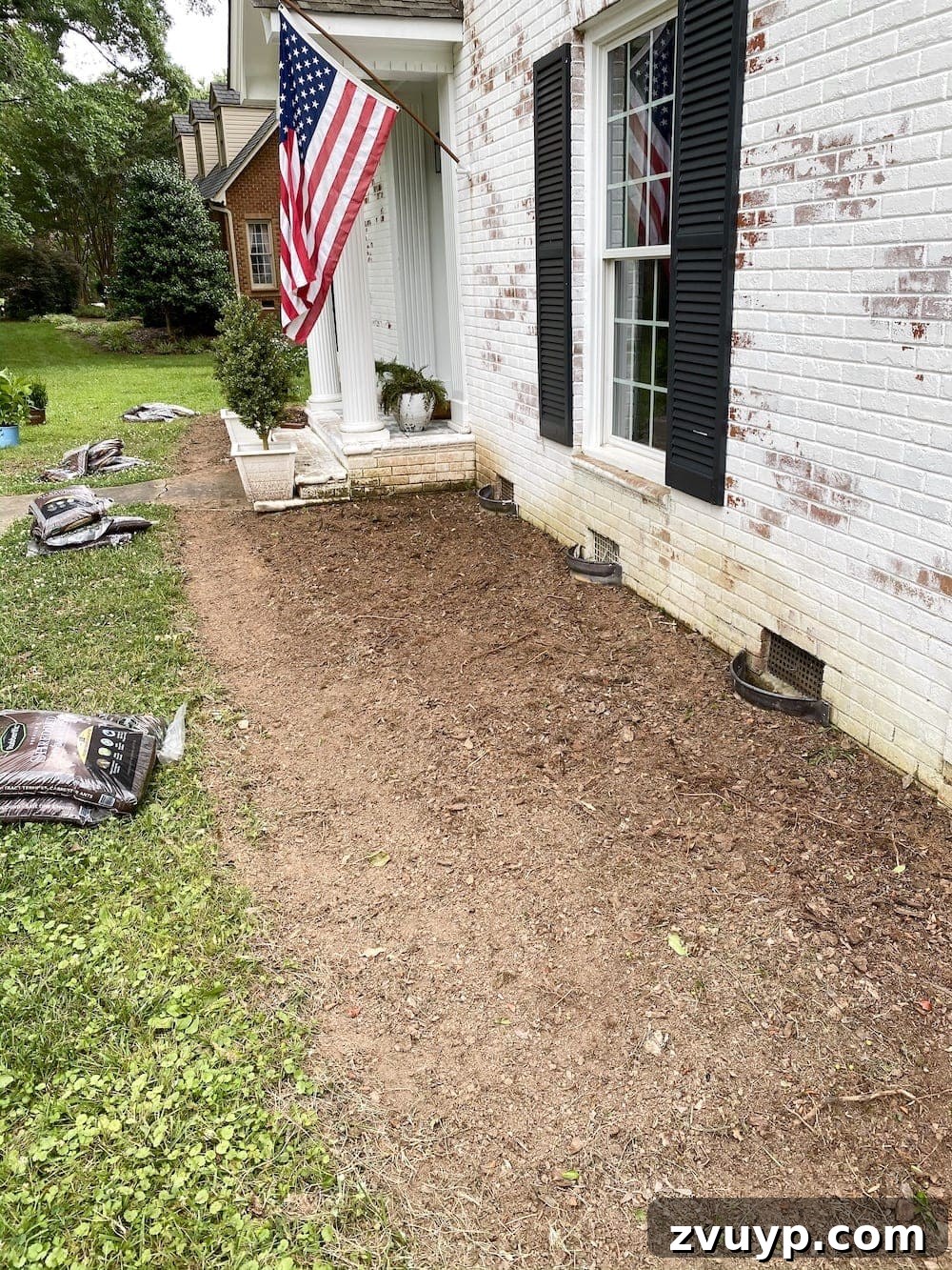 Front Flower Bed DIY Transformation 11 Tilling compacted soil in a flower bed using the STIHL Yard Boss with a Bolo Tines Cultivator attachment.