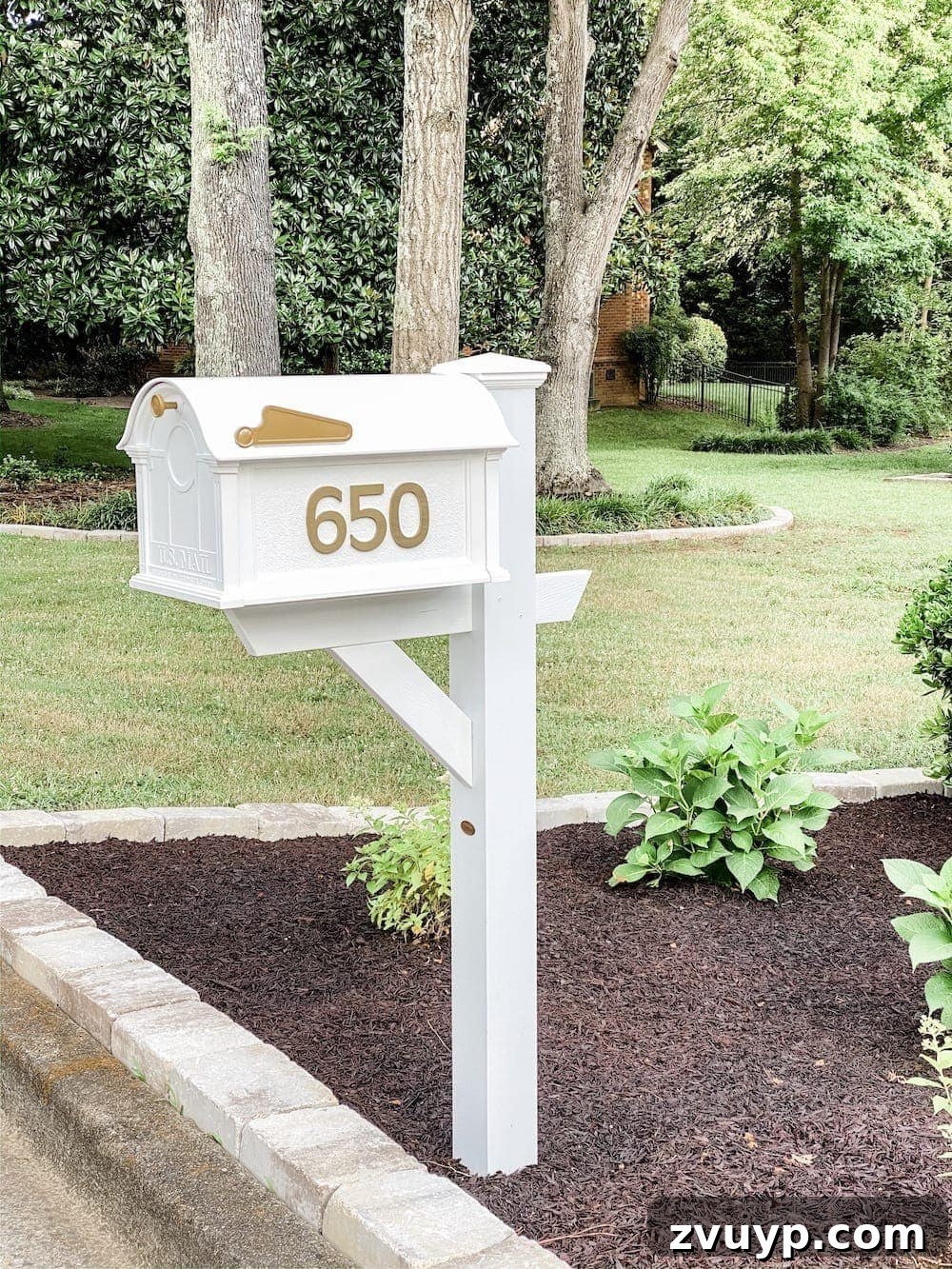 Front Flower Bed DIY Transformation 17 A newly installed elegant die-cast white mailbox, enhancing the curb appeal of the home.