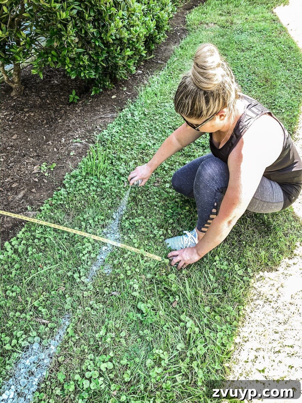 Front Flower Bed DIY Transformation 6 A step-by-step DIY tutorial on how to transform your flower beds, starting with planning and marking the layout.