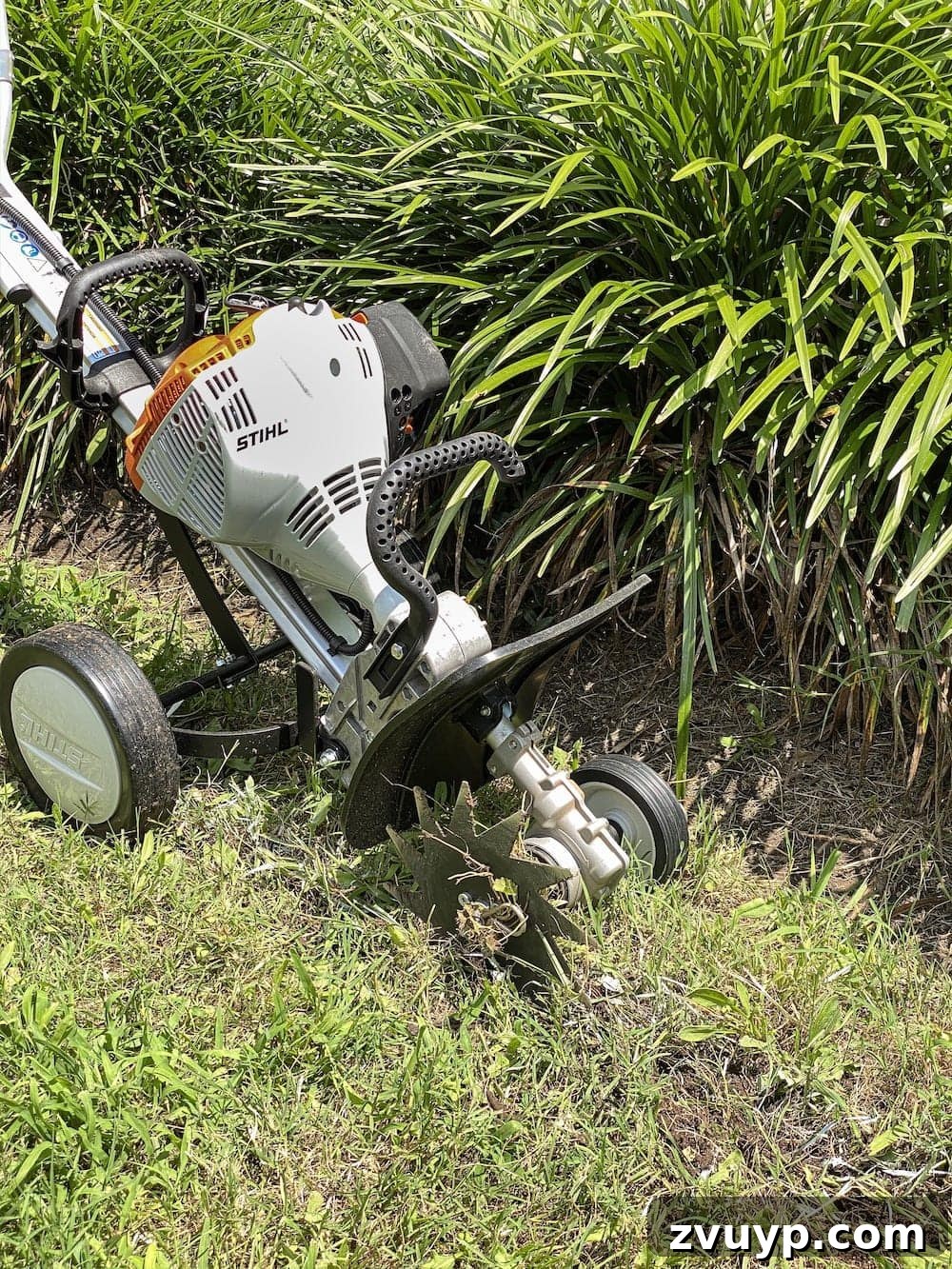 Front Flower Bed DIY Transformation 9 A close-up view of the STIHL Yard Boss edger attachment in action, demonstrating its effectiveness.