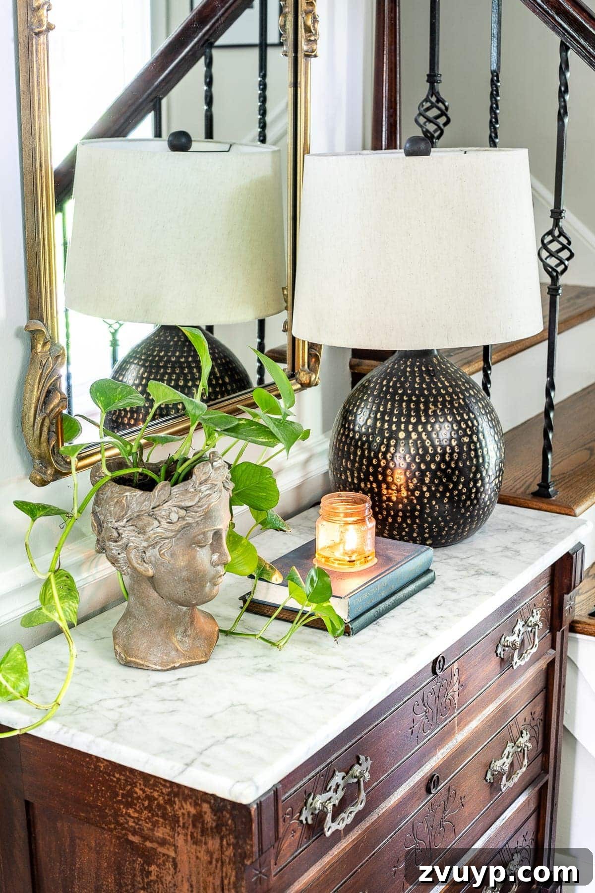 Foyer Evolution A Modern Twist on Classic Design 8 Foyer Styling - Bust Planter, Table Lamp, Books, and Candle on Chest