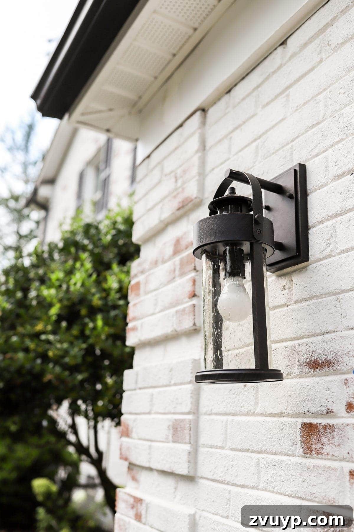 Revamping Our Garage Exterior with Bright New Lighting 7 New motion sensor outdoor lantern installed on the garage wall, beautifully illuminating the space.