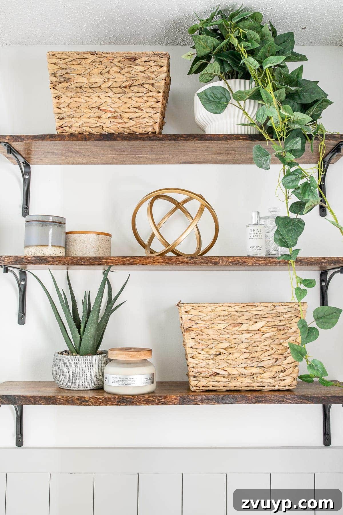 Golden State Powder Room Serenity 13 Bathroom shelves adorned with baskets, small storage items, vibrant plants, and decorative accents