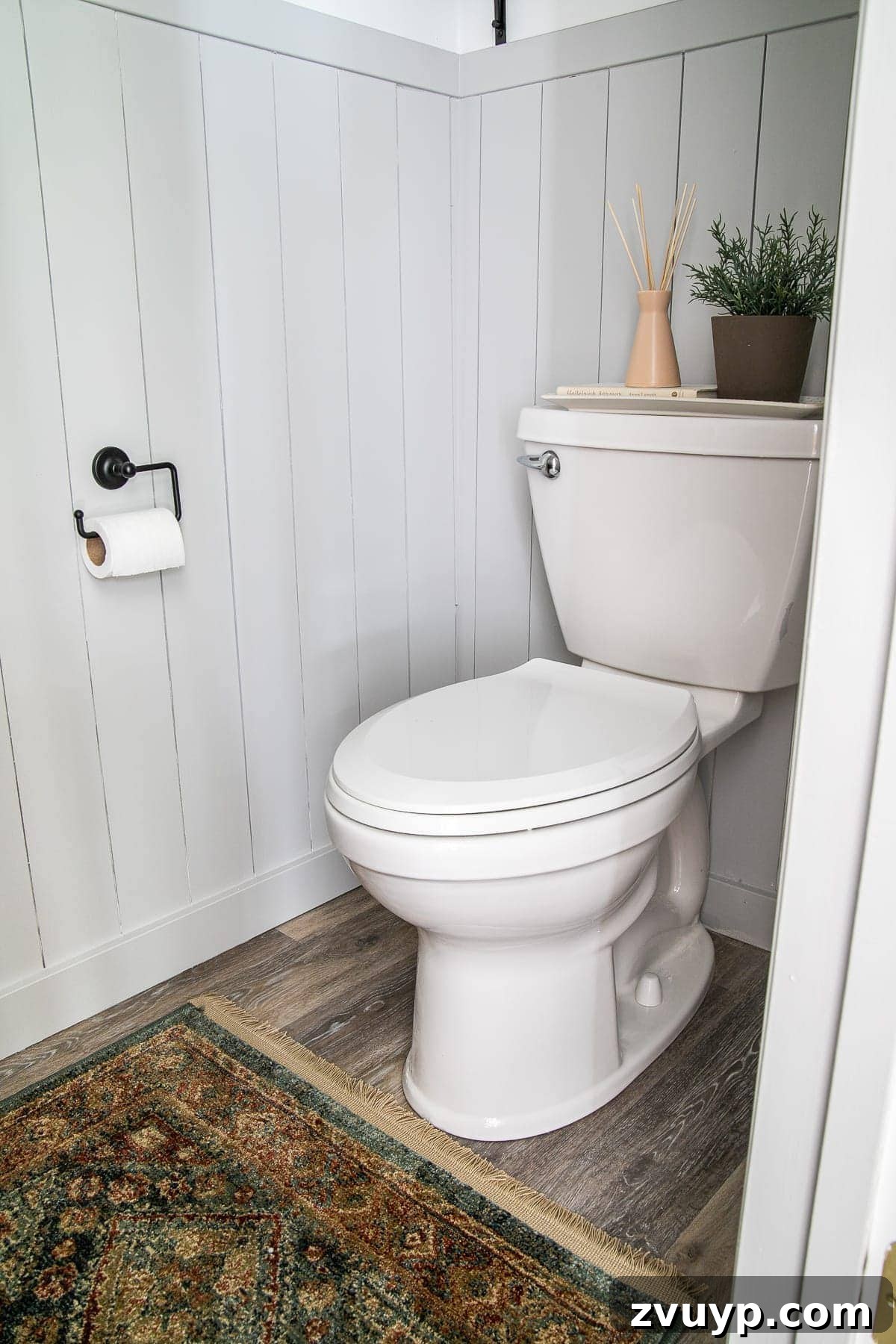 Golden State Powder Room Serenity 14 Small bathroom with stylish vertical shiplap walls and a vibrant vintage-style rug