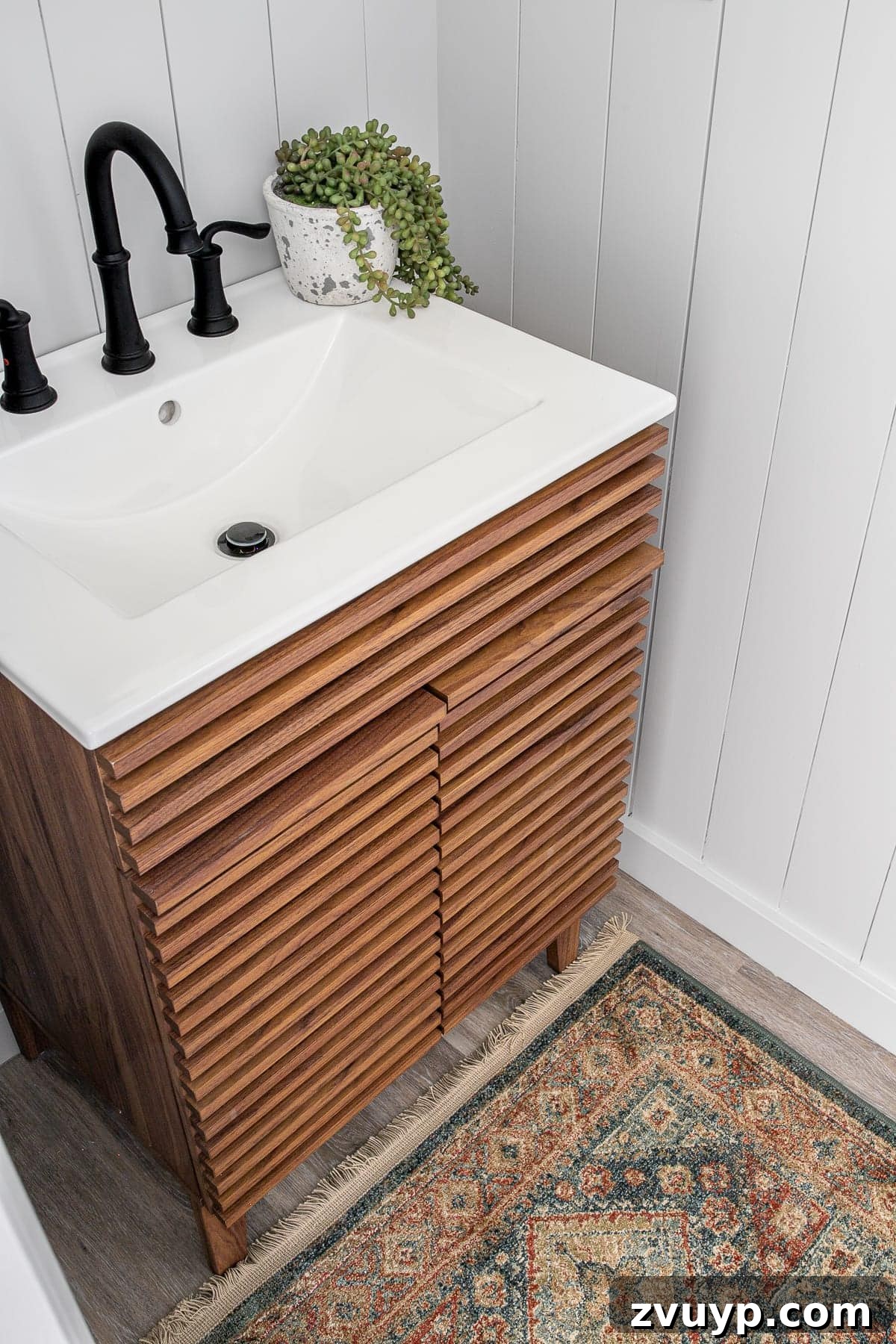 Golden State Powder Room Serenity 7 Mid Century Modern sink vanity paired with a vintage style rug in a California Casual powder room