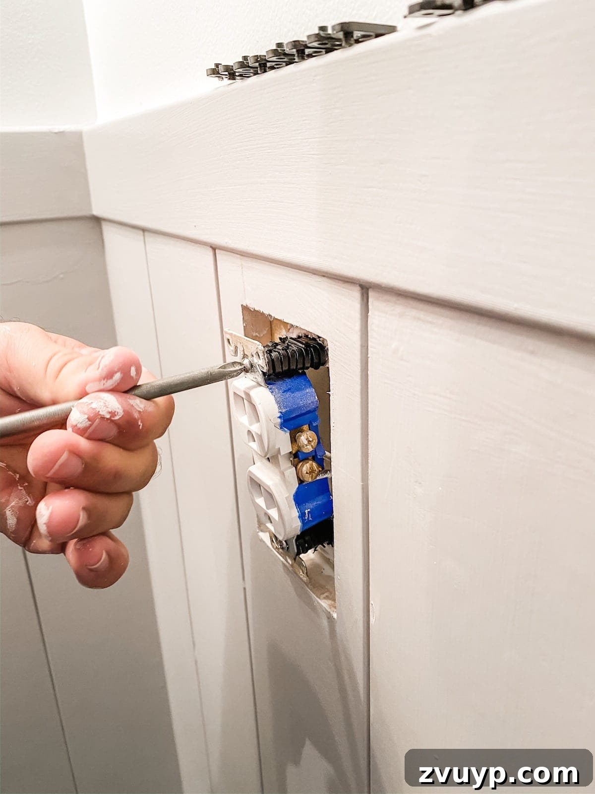 Effortless Bathroom Makeover: DIY Vertical Shiplap Wainscoting 13 Outlet spacers in action, making an outlet flush with newly installed shiplap.