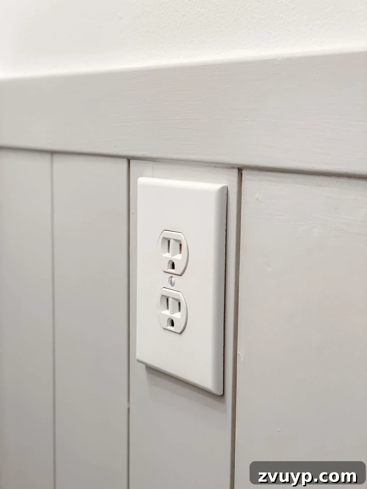 Effortless Bathroom Makeover: DIY Vertical Shiplap Wainscoting 14 Jumbo outlet cover installed over vertical shiplap, concealing cuts and achieving a clean finish.