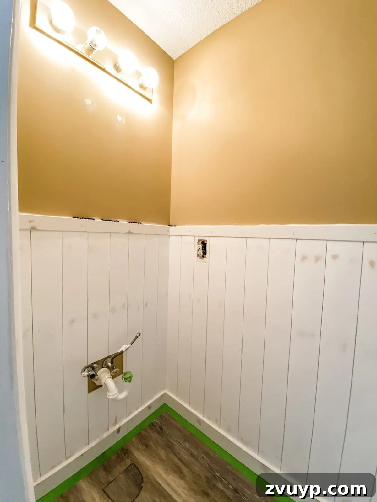 Effortless Bathroom Makeover: DIY Vertical Shiplap Wainscoting 16 Vertical shiplap wainscoting installed in a bathroom, ready for painting.