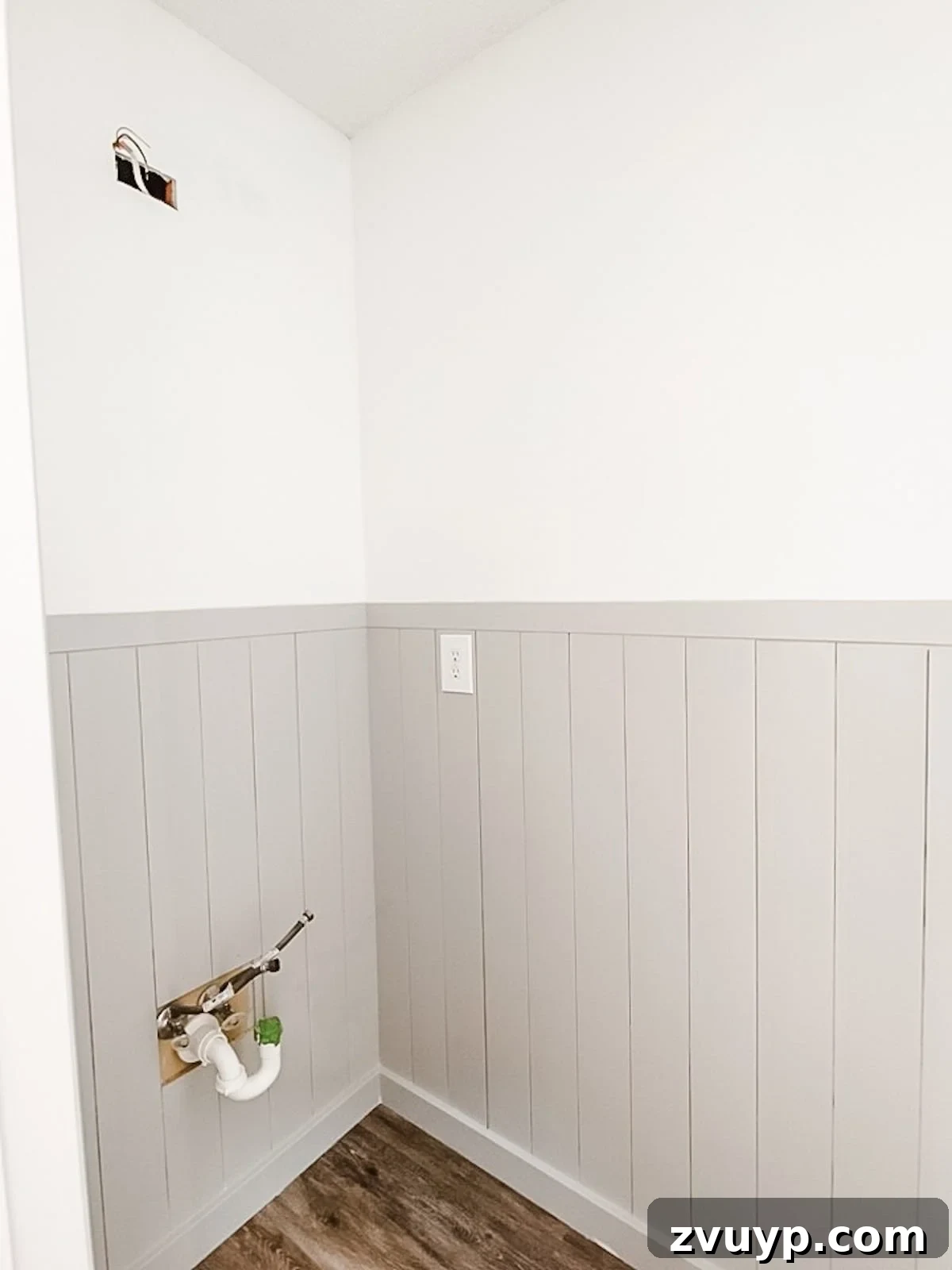 Effortless Bathroom Makeover: DIY Vertical Shiplap Wainscoting 18 Finished bathroom with vertical shiplap wainscoting painted Benjamin Moore Stonington Gray and walls in Chantilly Lace.