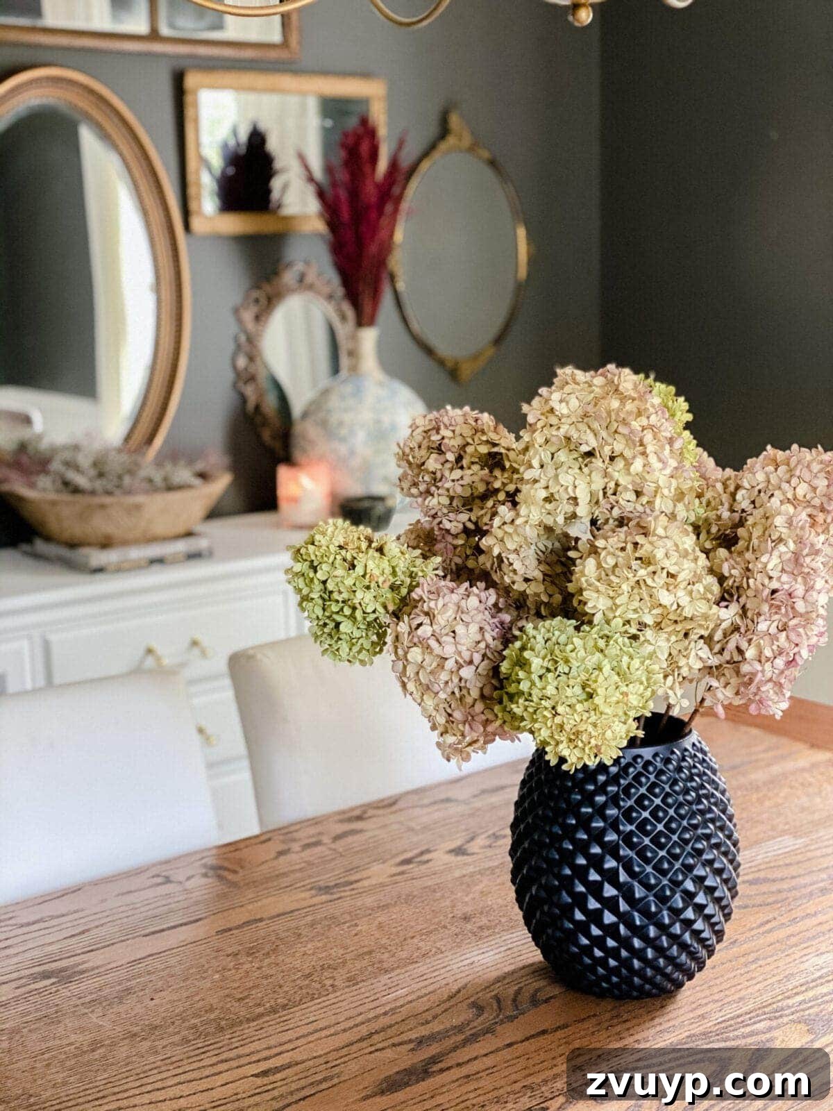 Create Your Cozy Fall Haven: DIY Decor Ideas 3 dried hydrangeas used as DIY fall decor to create a cozy home in a dining room