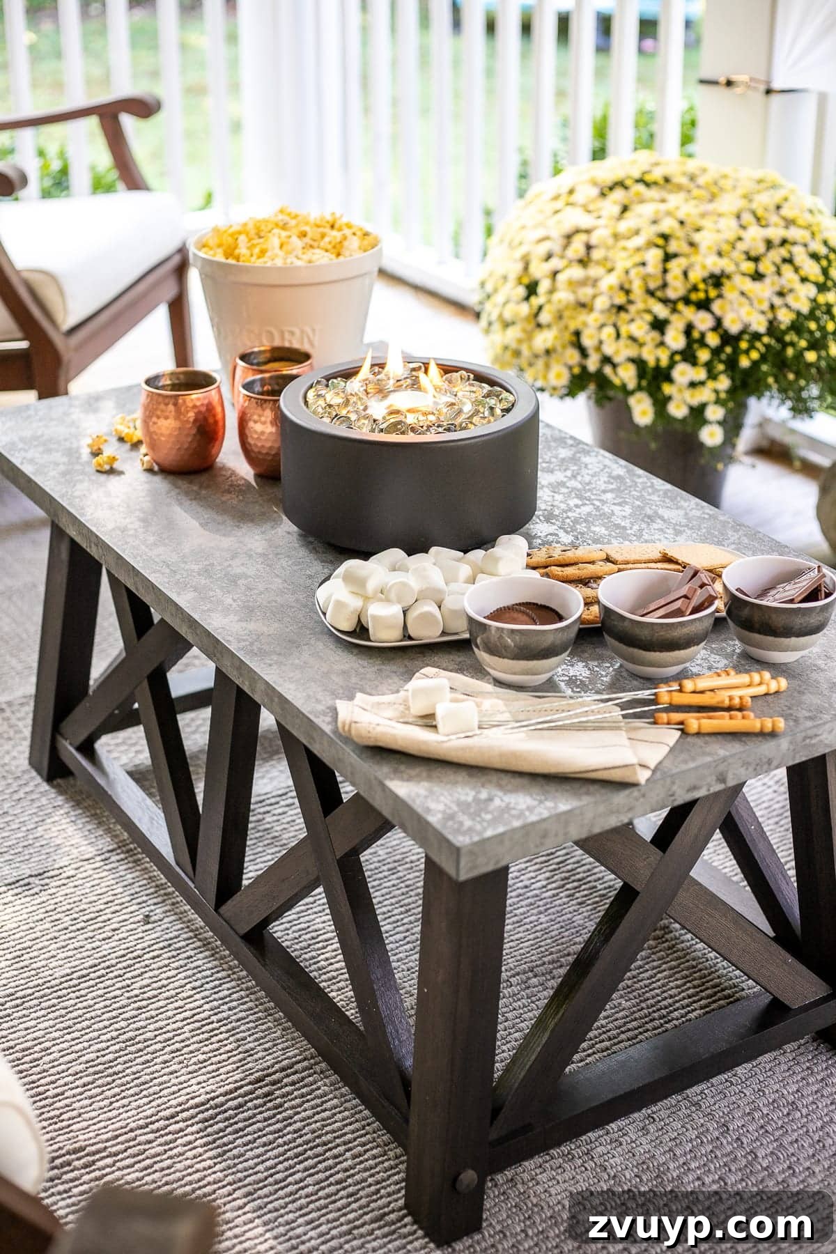 Create Your Cozy Fall Haven: DIY Decor Ideas 21 DIY s'mores table featuring a tabletop fire pit and s'mores ingredients