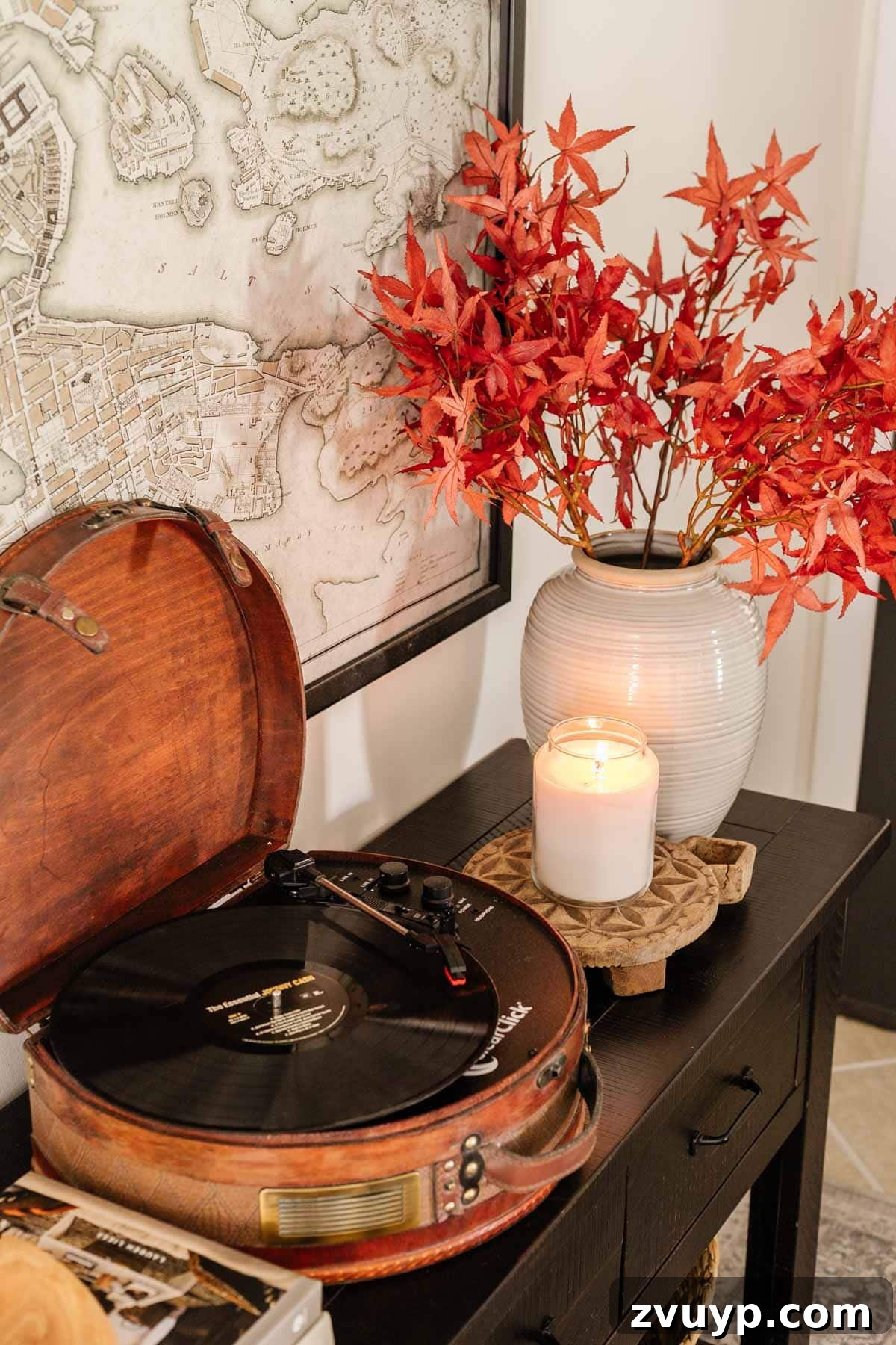 Create Your Cozy Fall Haven: DIY Decor Ideas 27 record player and vase of fall leaves