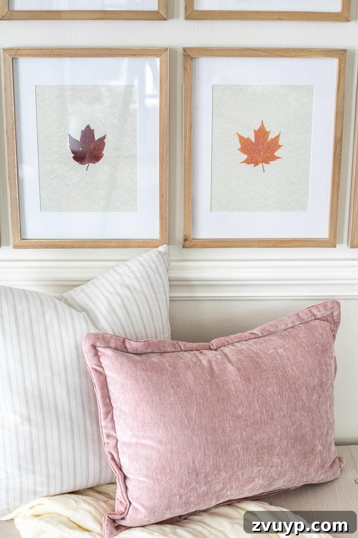 Pressed Leaf Gallery Wall: Autumn Entry Decor 6 Close-up of framed pressed fall leaves, showcasing natural textures and colors, beside neutral and blush throw pillows