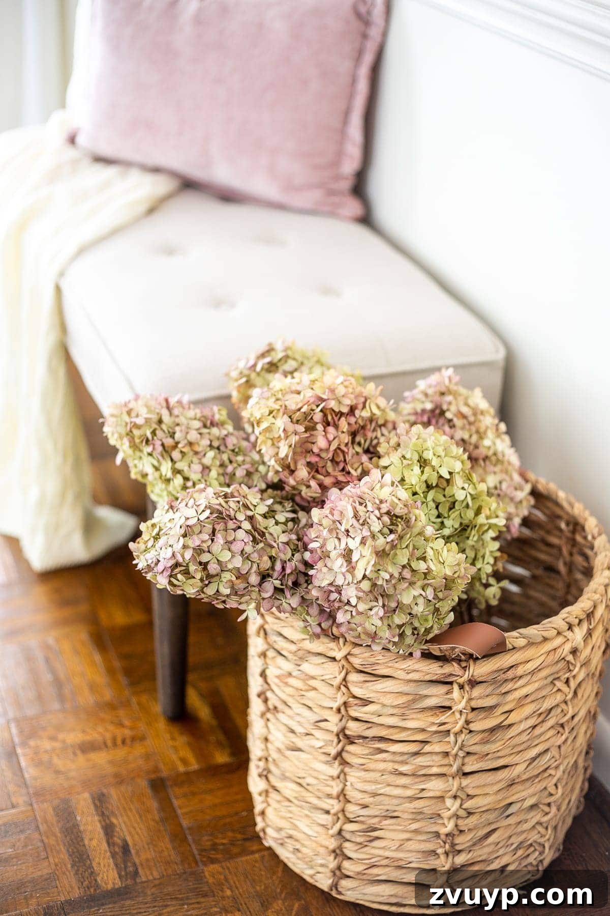 Pressed Leaf Gallery Wall: Autumn Entry Decor 8 Rustic basket filled with dried hydrangeas, placed next to an entryway bench, enhancing the fall decor