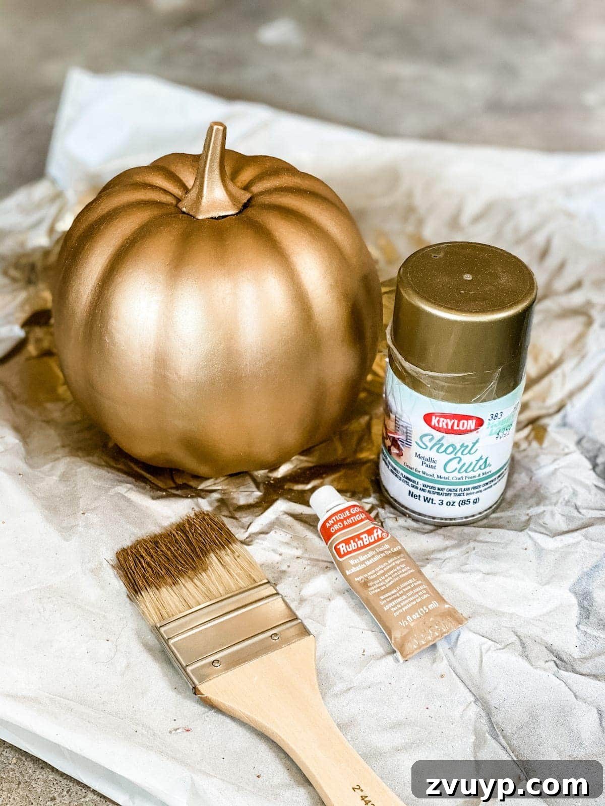 Modern Pumpkin Makeovers: 3 Creative Paint Ideas 4 Applying Rub 'n Buff to fake pumpkin for antique brass look