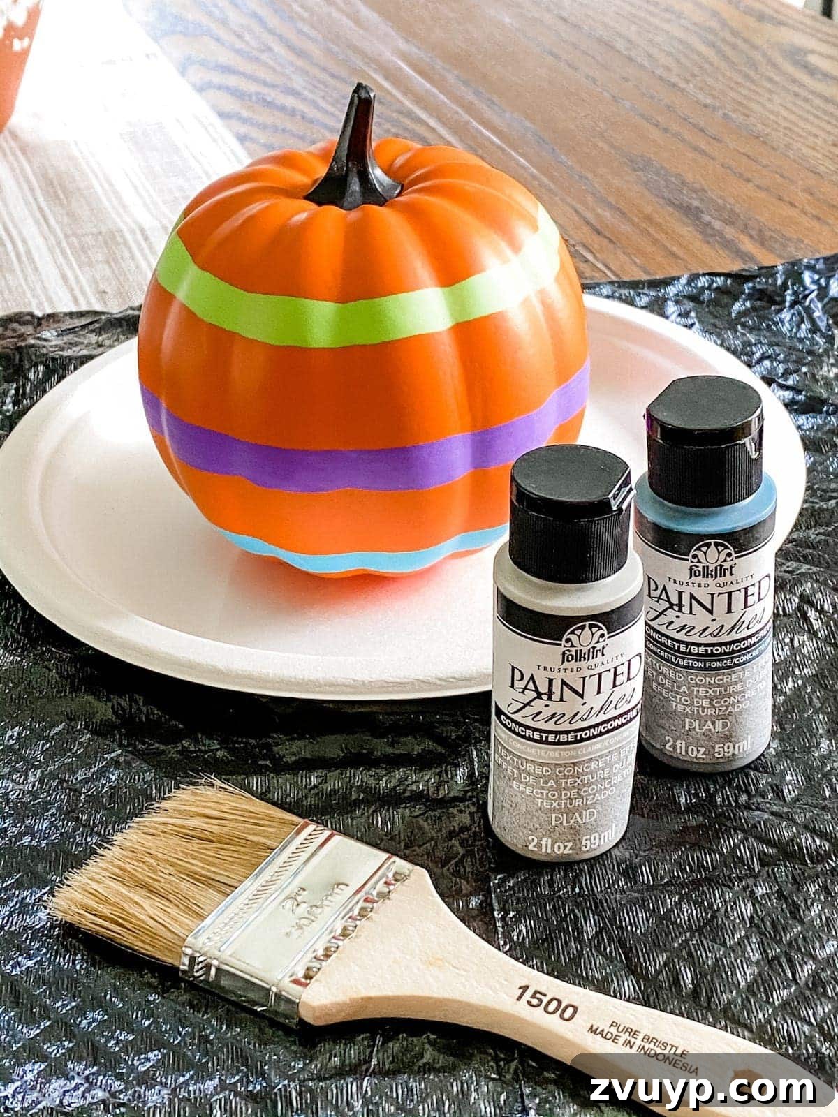 Modern Pumpkin Makeovers: 3 Creative Paint Ideas 6 Fake pumpkin painted with light gray for concrete look