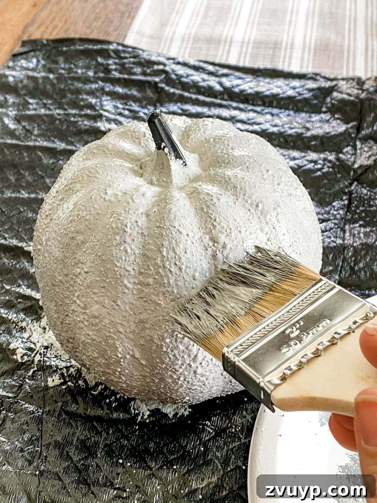 Modern Pumpkin Makeovers: 3 Creative Paint Ideas 7 Applying dark gray paint to wet light gray for concrete texture