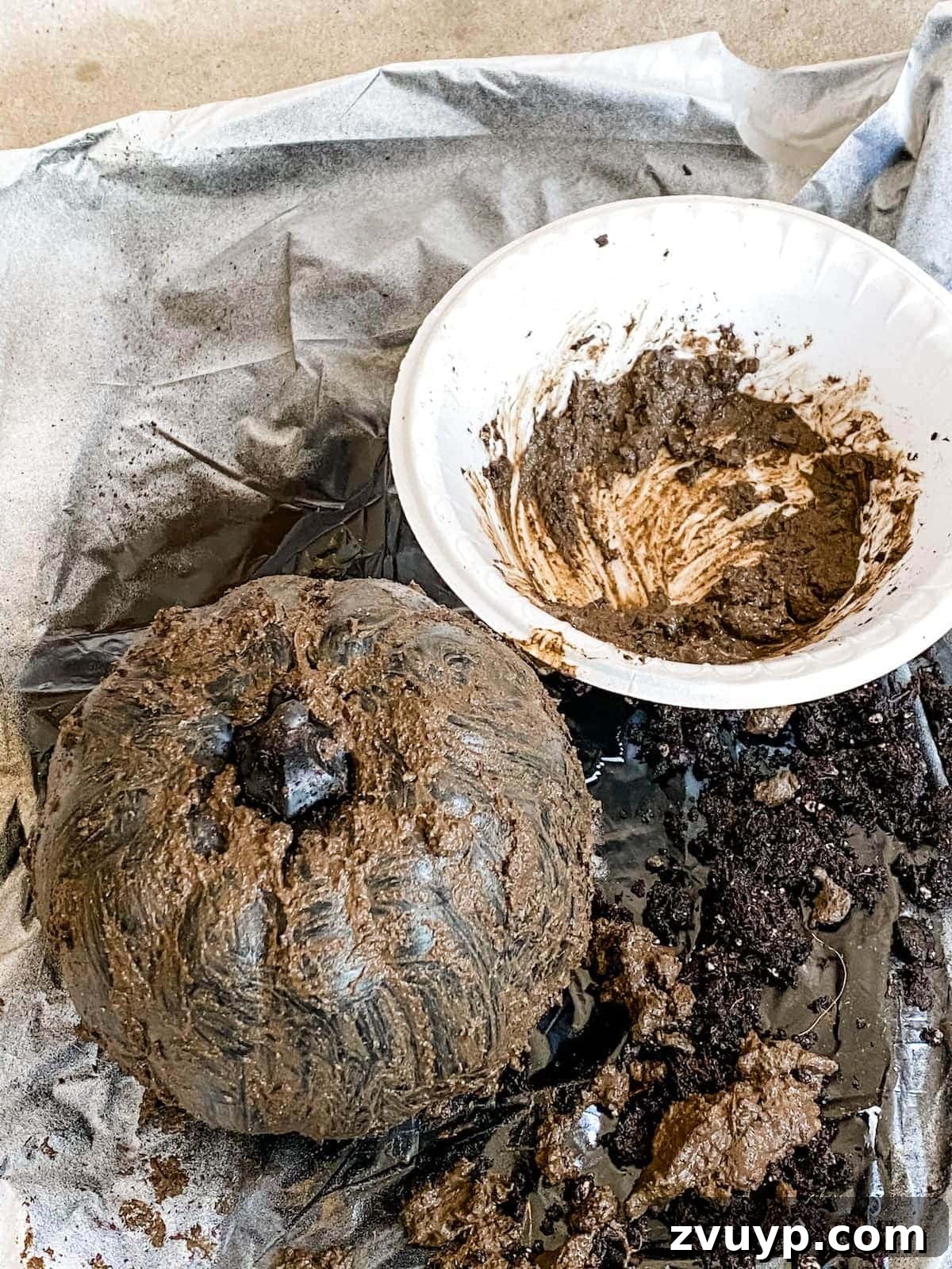 Modern Pumpkin Makeovers: 3 Creative Paint Ideas 10 Applying mud to black pumpkin for earthenware effect