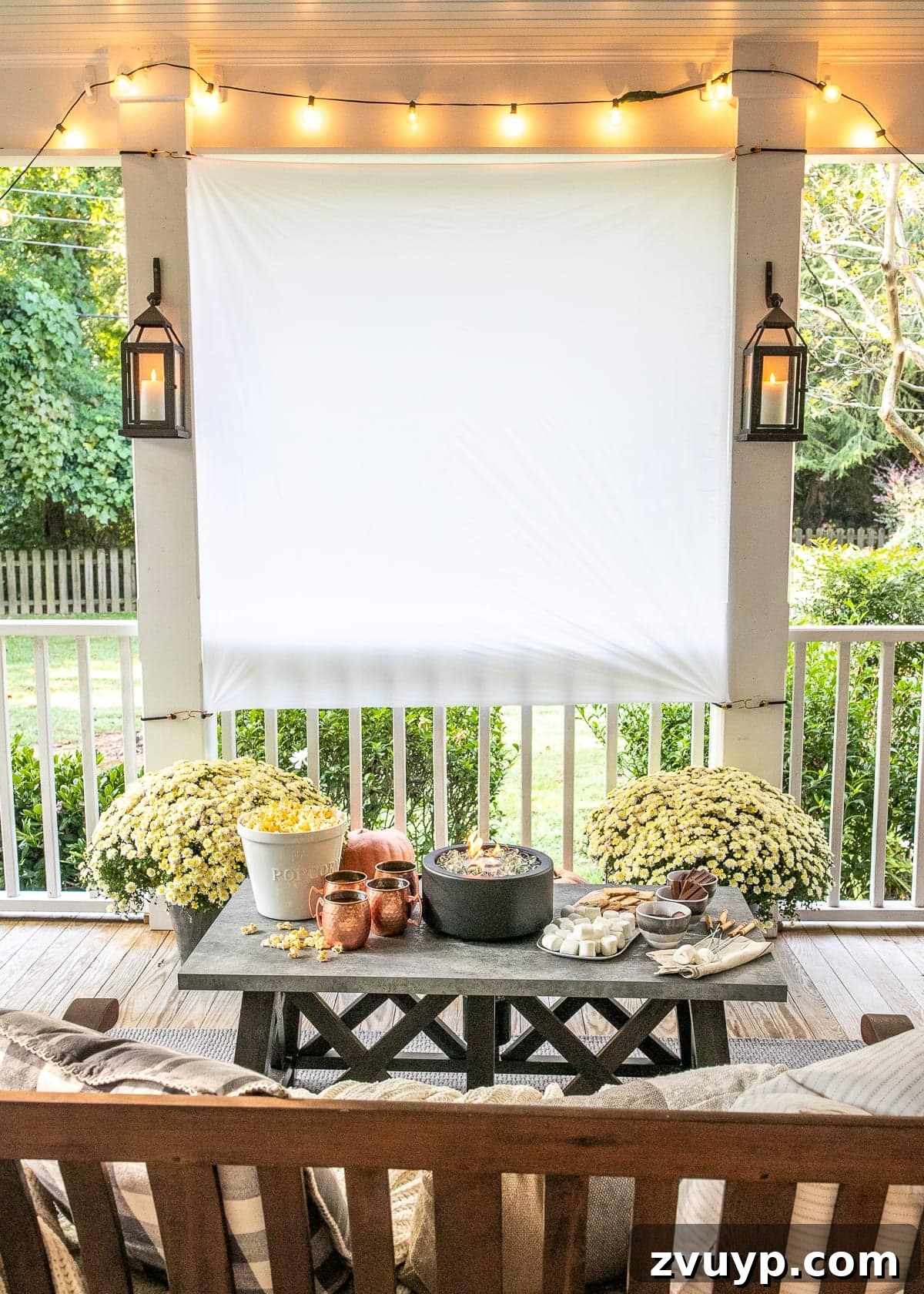Backyard Cinema with S'mores DIY Outdoor Movie Screen and S'mores Table set up for a fall evening