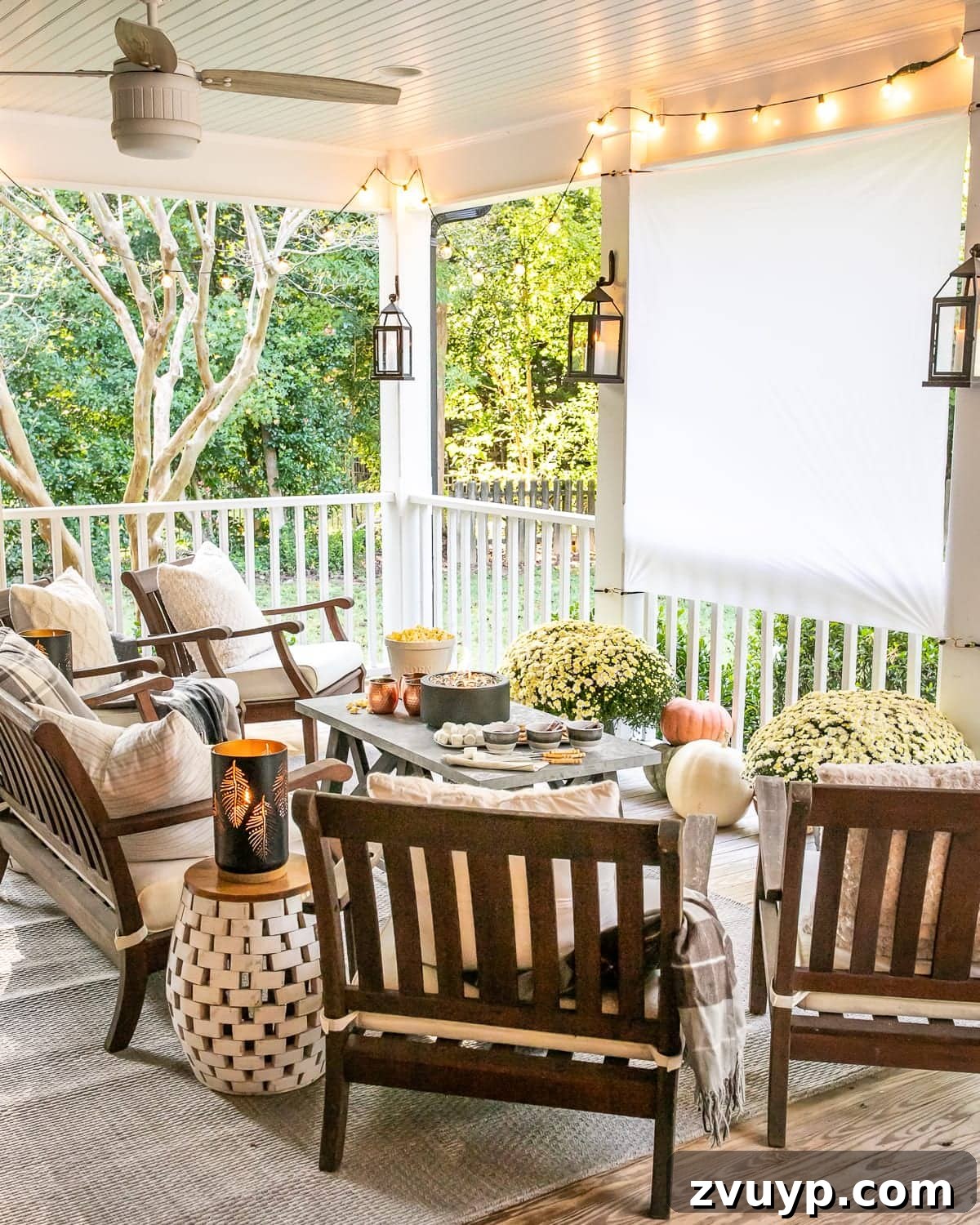 Fall Decorated Outdoor Cinema DIY Outdoor Movie Screen decorated with fall mums and pumpkins